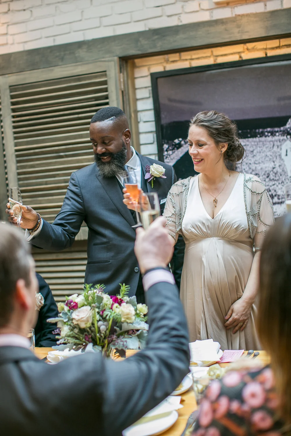 The bride and groom toasting at their Intimate Restaurant Wedding in Manhattan. | Upper West Side Intimate Wedding | Kate & Sylvester's wedding in Manhattan.
