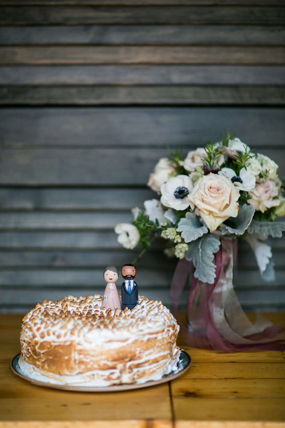 Single tier wedding cake with wooden cake toppers at an Intimate Restaurant Wedding in Manhattan | Upper West Side Intimate Wedding | Kate & Sylvester's wedding in Manhattan.