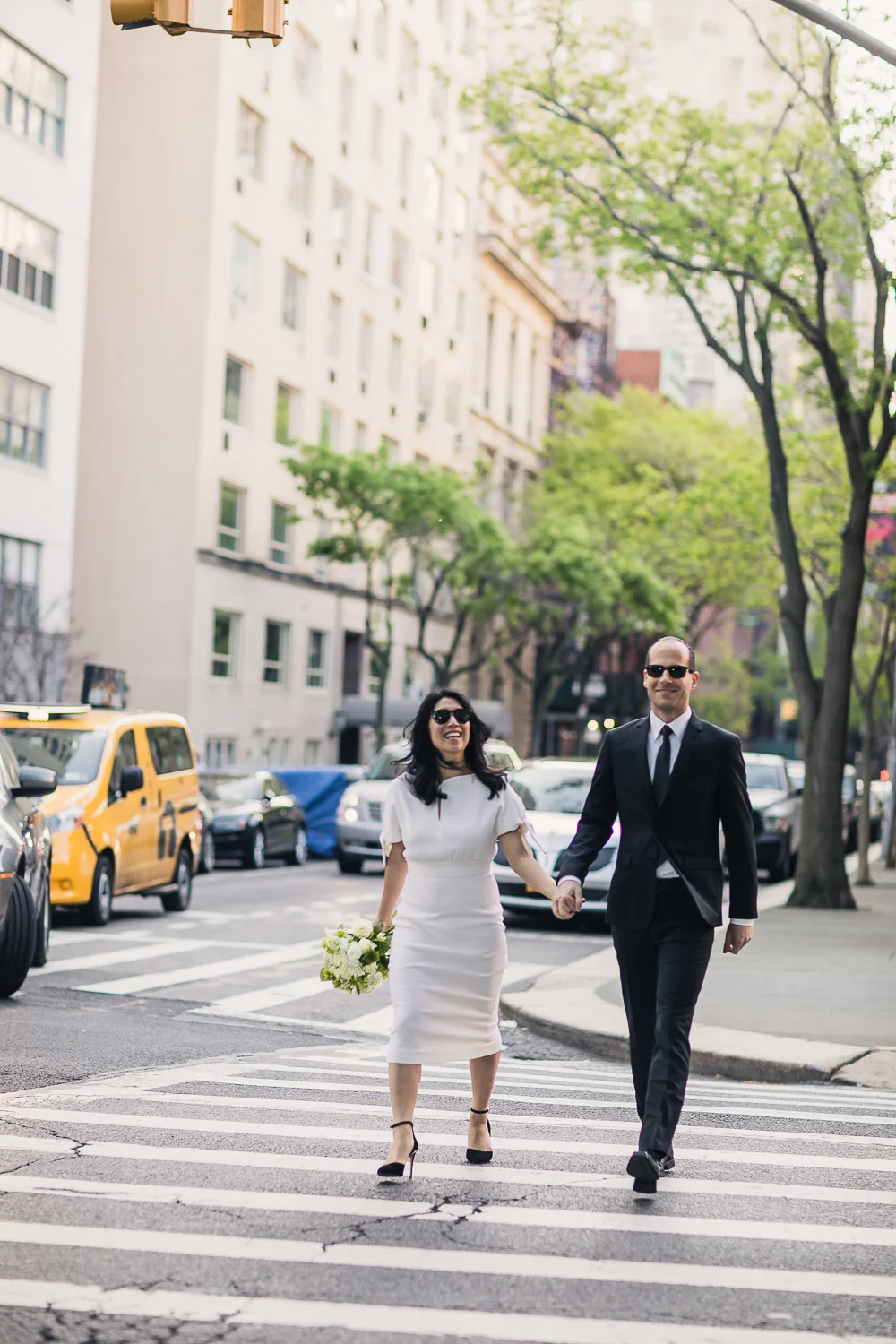 Bride and groom taking wedding photos in Central Park. | Early Morning Sunrise Central Park Elopement in New York City.