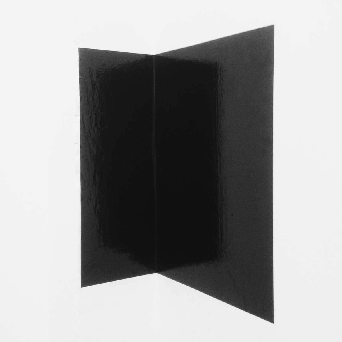  Untitled (introspection)  2014, Temporary site specific installation, black glossy vinyl adhered to a corner, approx 36 inches high  