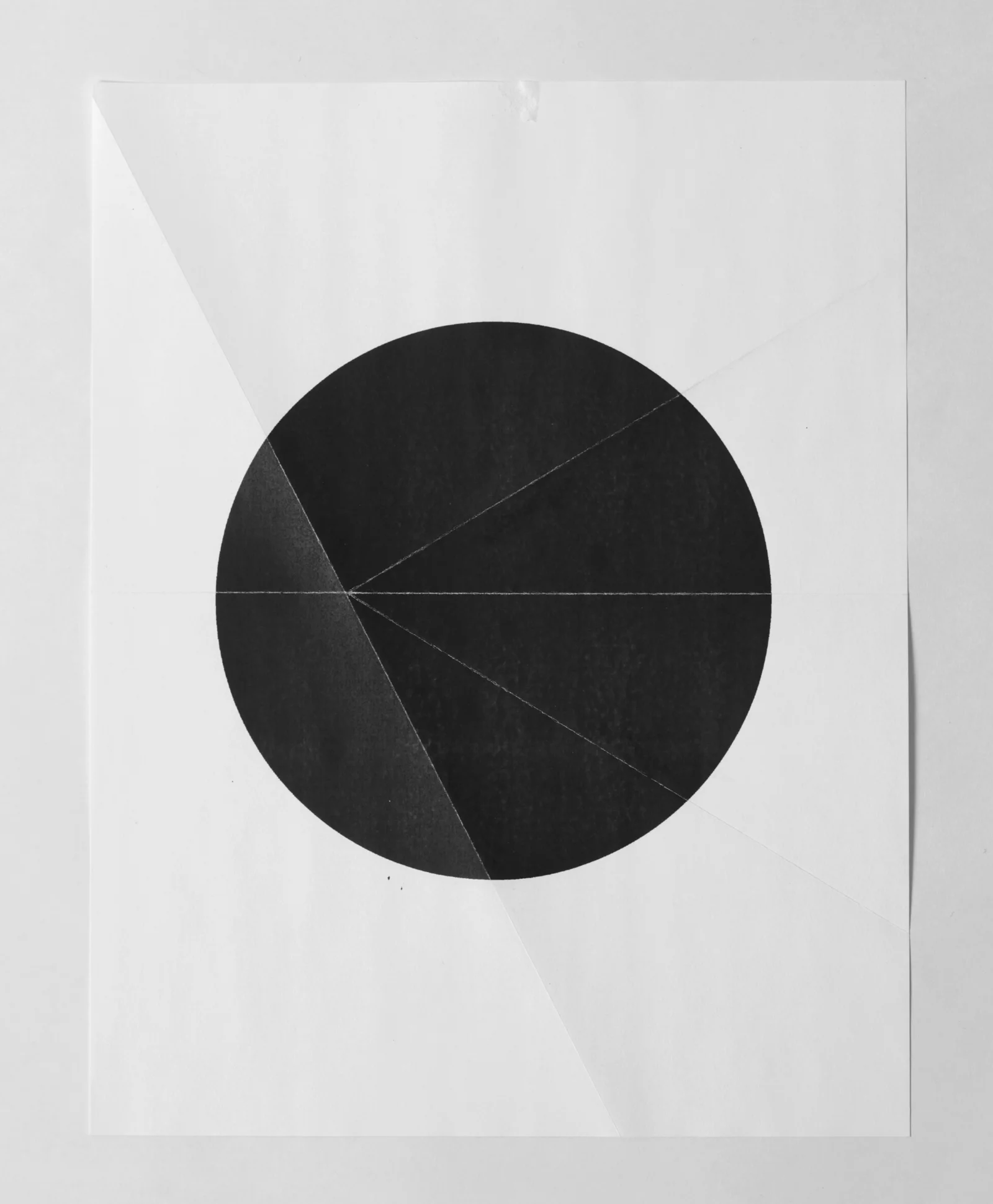   from the ongoing series: O/, Divided/Defined, Weights, Measures, and Emotional Geometry  2013, Folded photocopied circle. 8 x 10 inches folded 