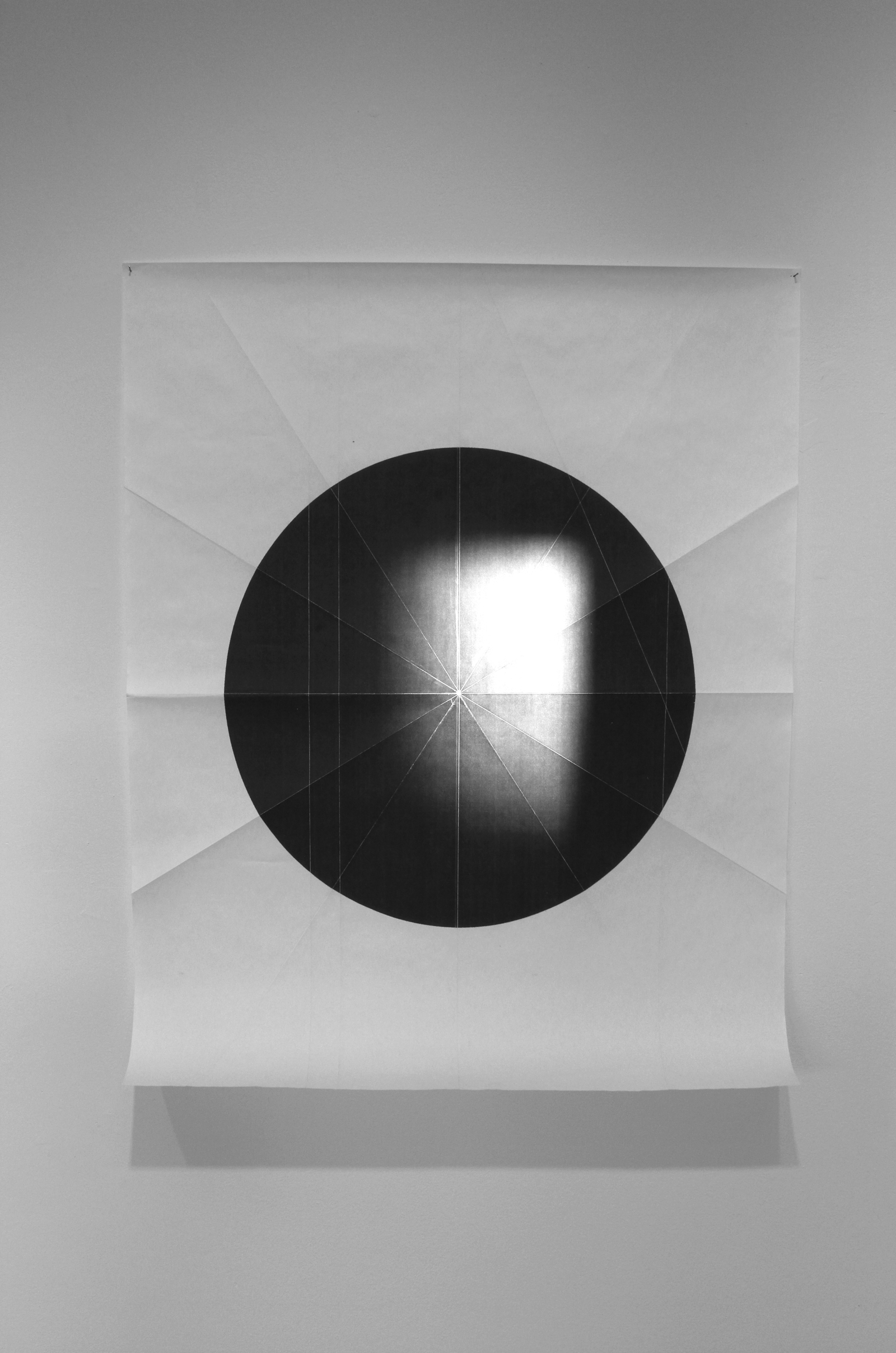   from the ongoing series: O/, Divided/Defined, Weights, Measures, and Emotional Geometry  2011, Folded photocopied circle (pictured here with sun) 107 x 63 inches 