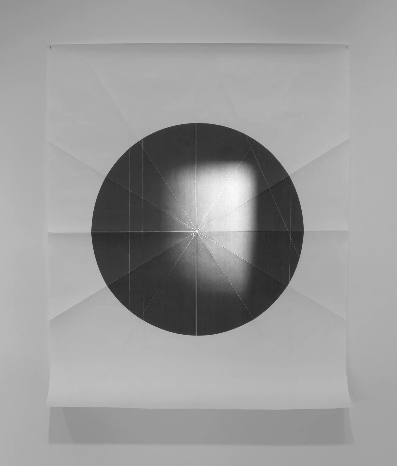    from the ongoing series: O/, Divided/Defined, Weights, Measures, and Emotional Geometry  2011, Folded photocopied circle (pictured here with sun) 107 x 63 inches  