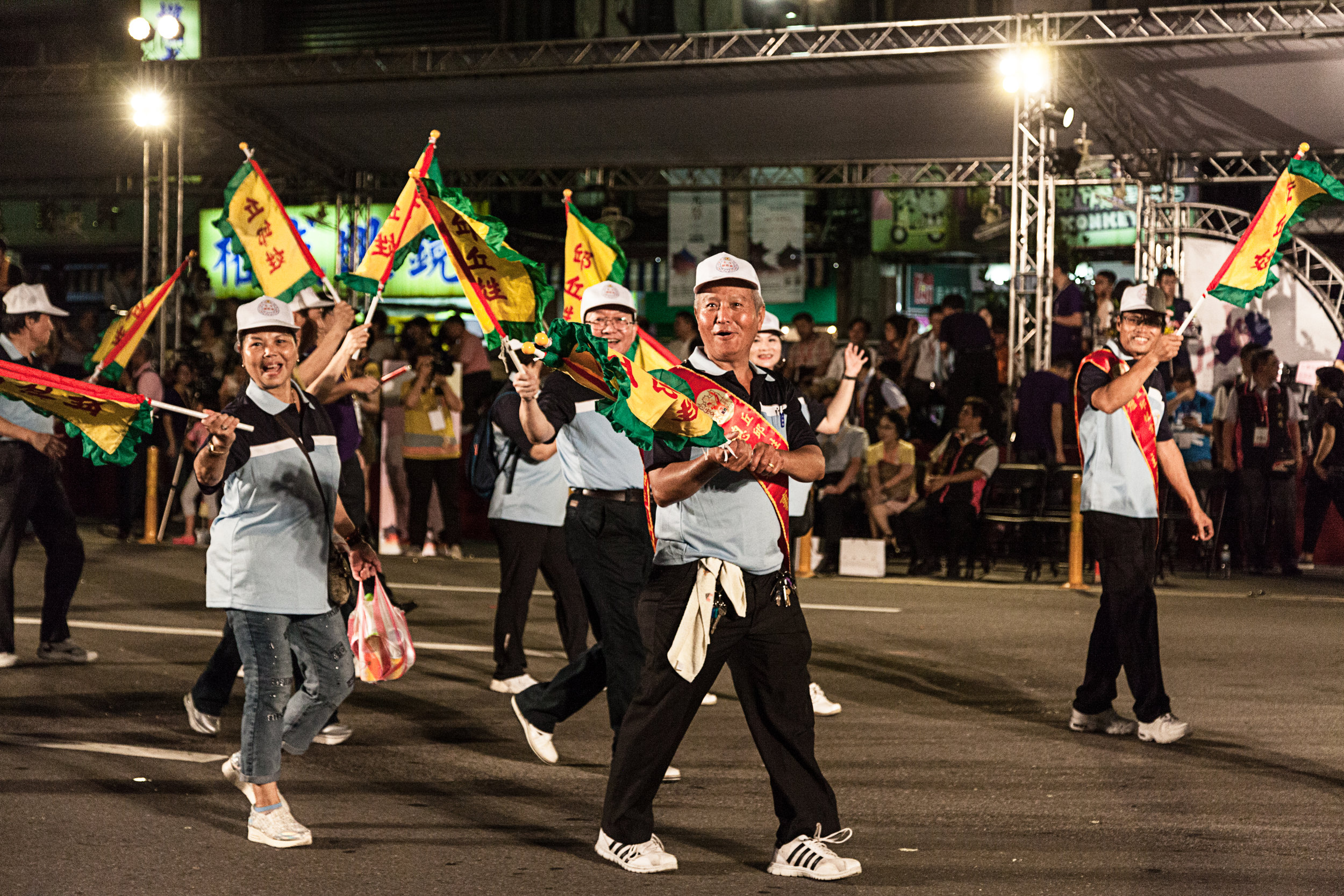 Various clubs and organizations marched by the crowd, dignitaries, and photographers
