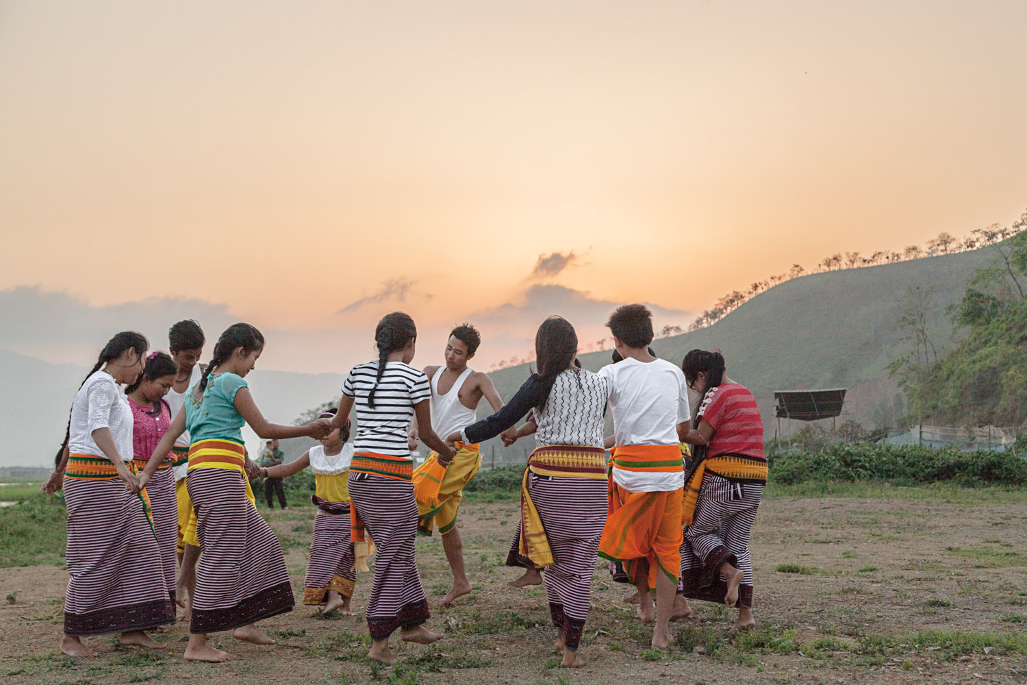 Young Manipuris dance on the shores of Loktak Lake. Meitei culture is ancient, vibrant, and unique; it burrows into one's consciousness and remains there long after leaving. I know that I will return.