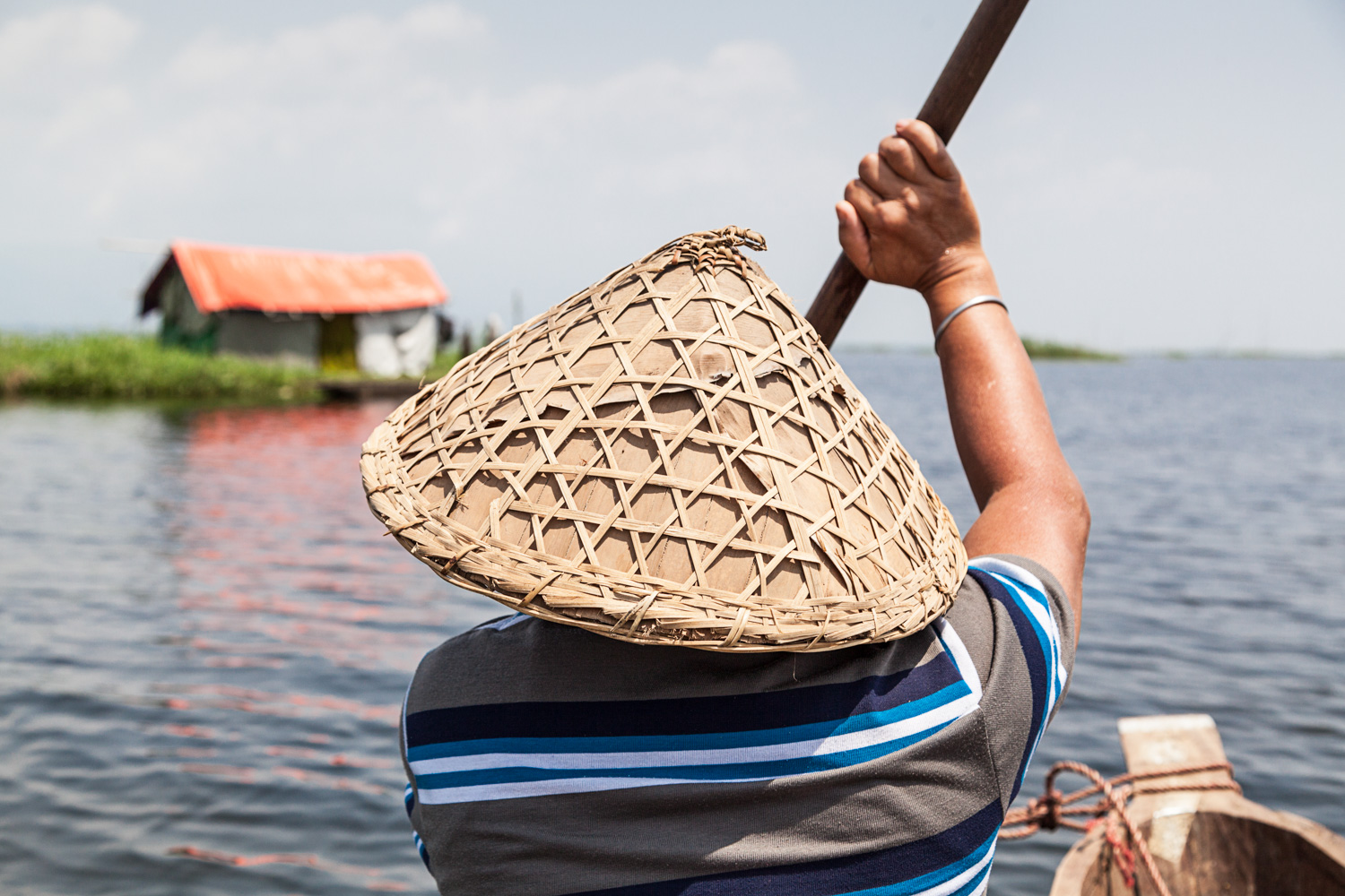Oinam Maipackchao rowed us in baking heat toward a fisherman's hut built on a floating phumdi.