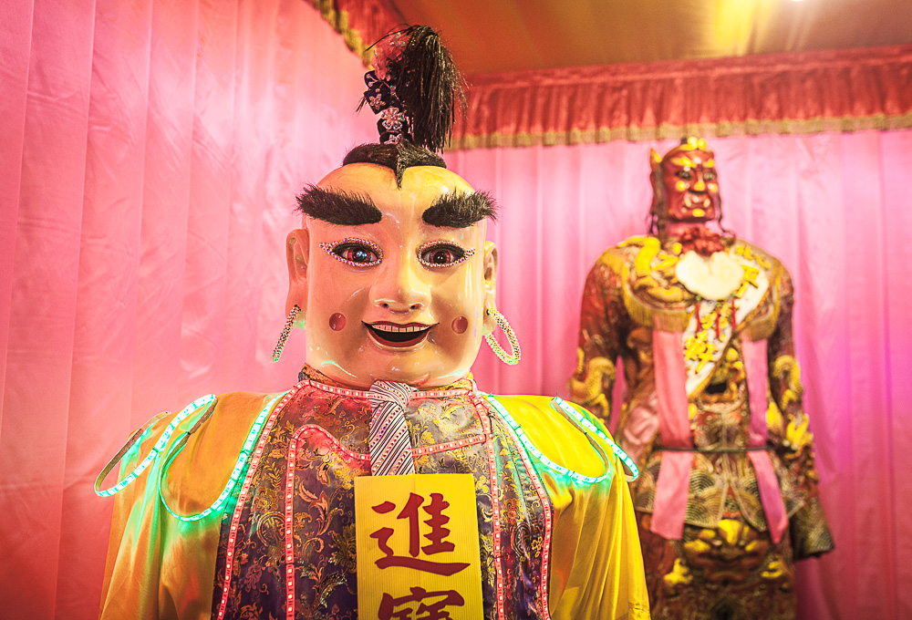 Chinese New Year preparations: A pair of decorated Chinese gods under a tent in Dadaocheng Park — Dihua Street, Old Taipei