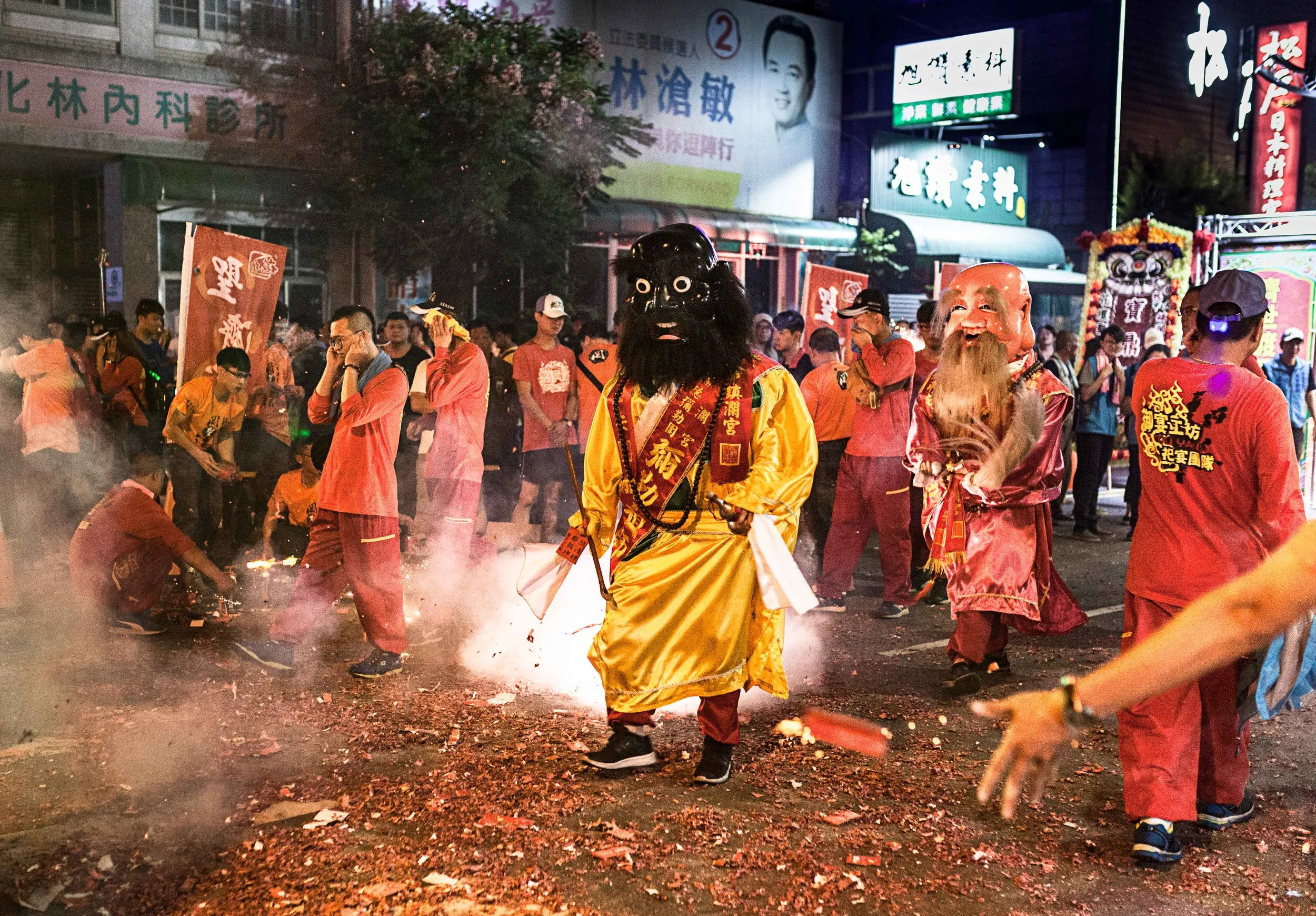 In Changhua City, enormous lit firecrackers were hurled into the paths of performers dressed as Taiwanese gods and folk characters. Many remain in costume as well as character for much of the route. 