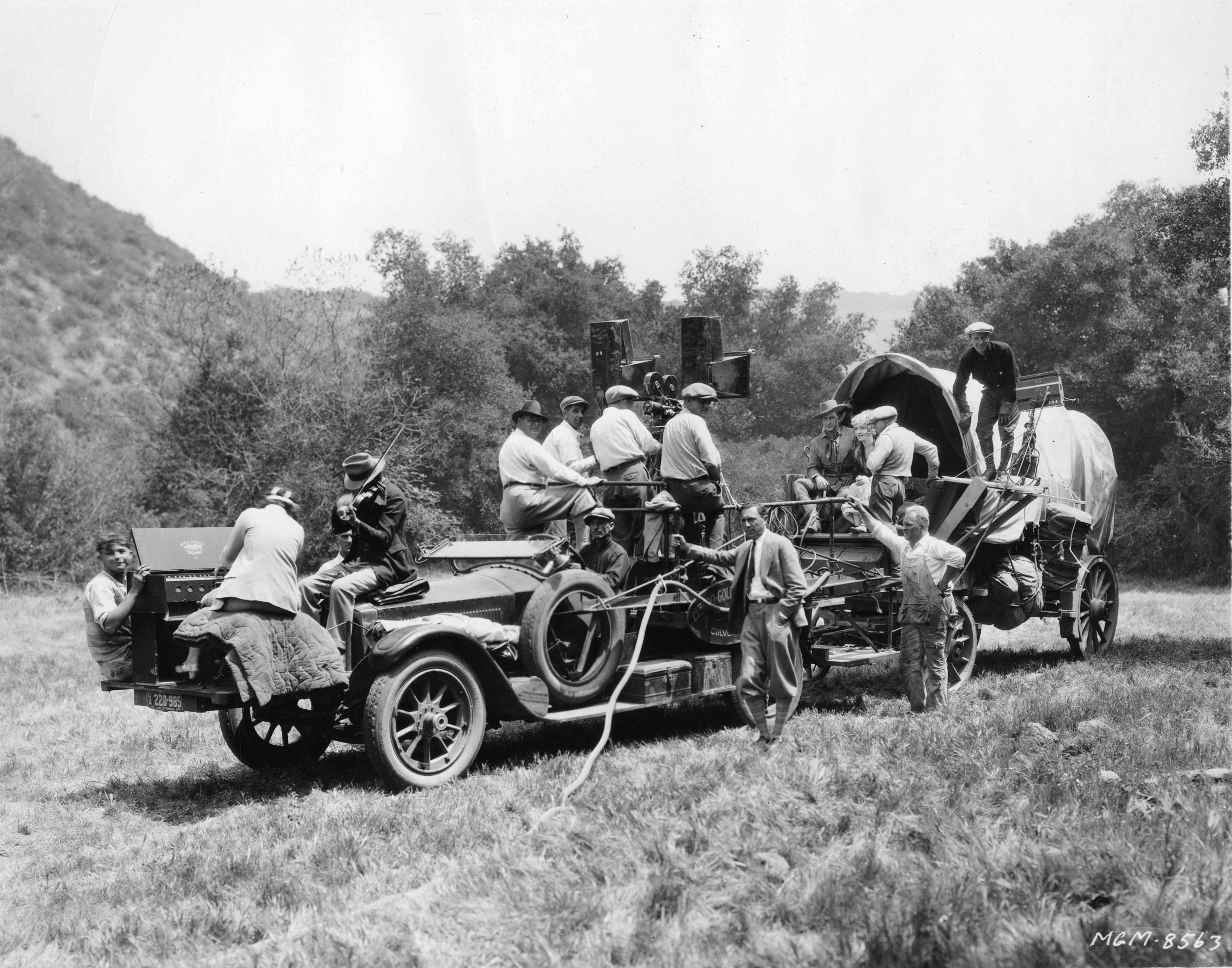 Fig03_04 Behind the scenes - locations- Lasky Ranch - MGM 1927 'The Frontiersman' with Tim McCoy, director Reginald Barker and Claire Windsor on Covered Wagon - Set musicians.jpg