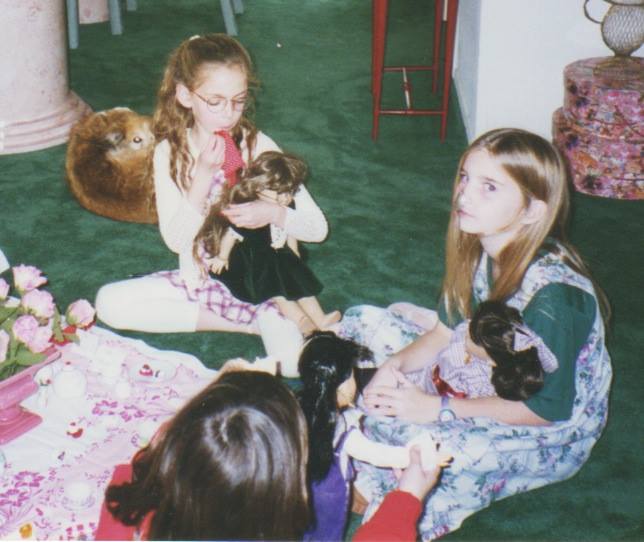 I teach my doll how to be proper; Jewels teaches her doll how to balance a spoon on her nose.