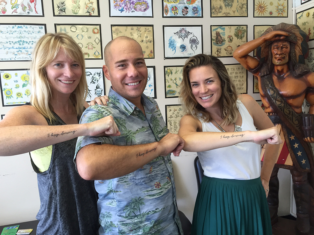 Ed with Julia's sisters and new "framily", showing off their tats