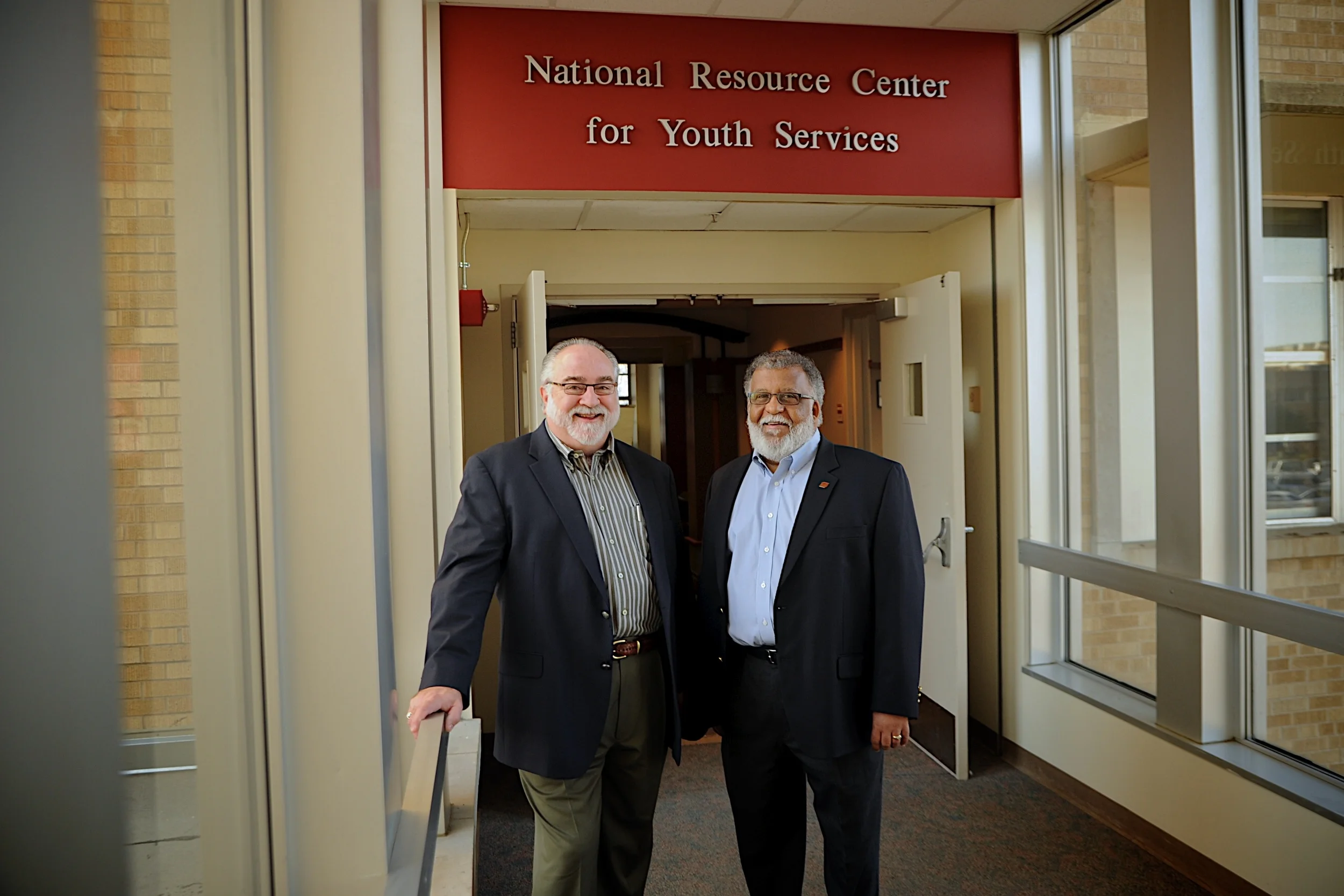 Jim Walker and Peter Correia both work in the area of youth services and have been professional colleagues and personal friends for years. Photographed at University of Oklahoma in Tulsa.