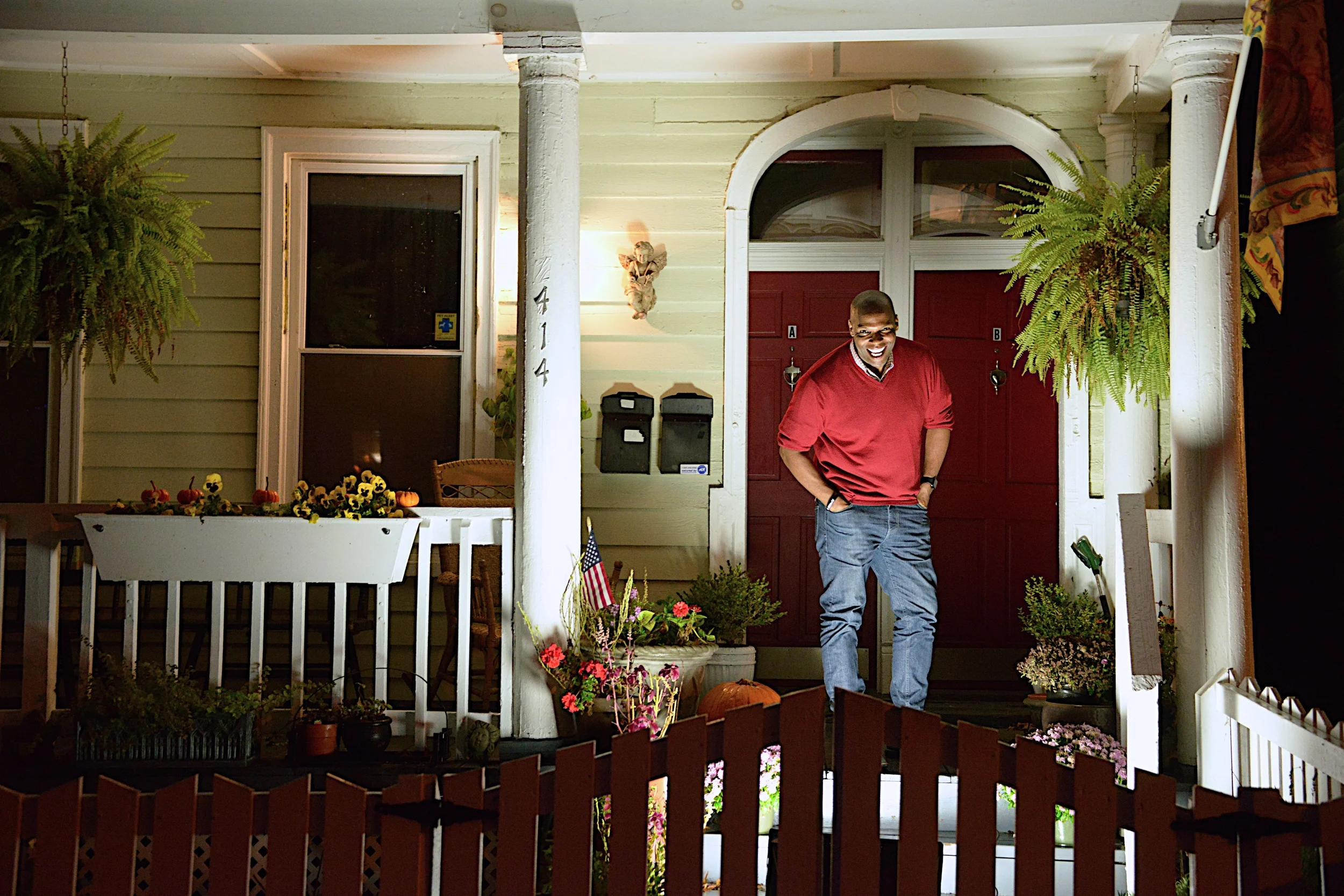Photographed on the front porch of the first home he has owned located on historic Church Hill.