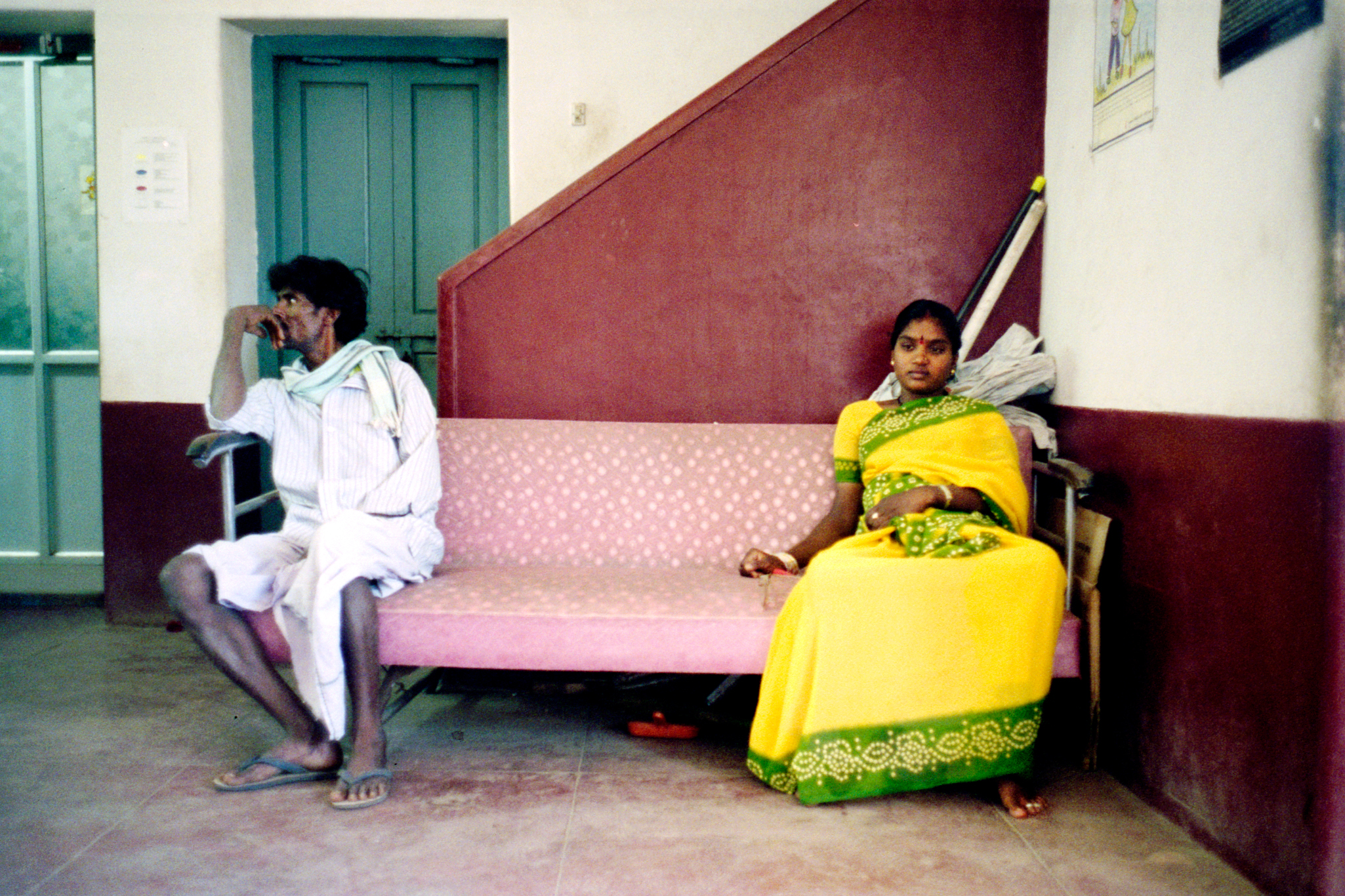  Shobha and her father wait at Asha Kirana, an HIV clinic. Shobha is 19 and has been married for little over a year. She is seven months pregnant and positive. Her husband, a truck-driver, does not want the child. One month later, Shobha will abort h