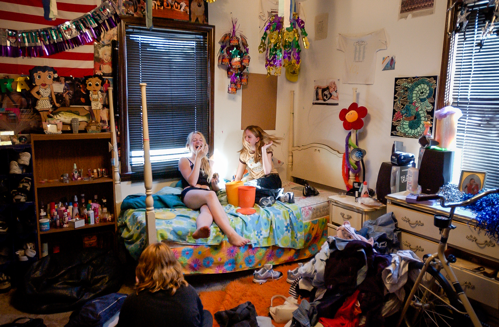  Spirit, Bre, and Brittney share mom's homemade cookies while listening to music. Spirit's room is filled with pictures of Nelly, Britney Spears, fast cars, professional wrestlers and her immense wardrobe. 