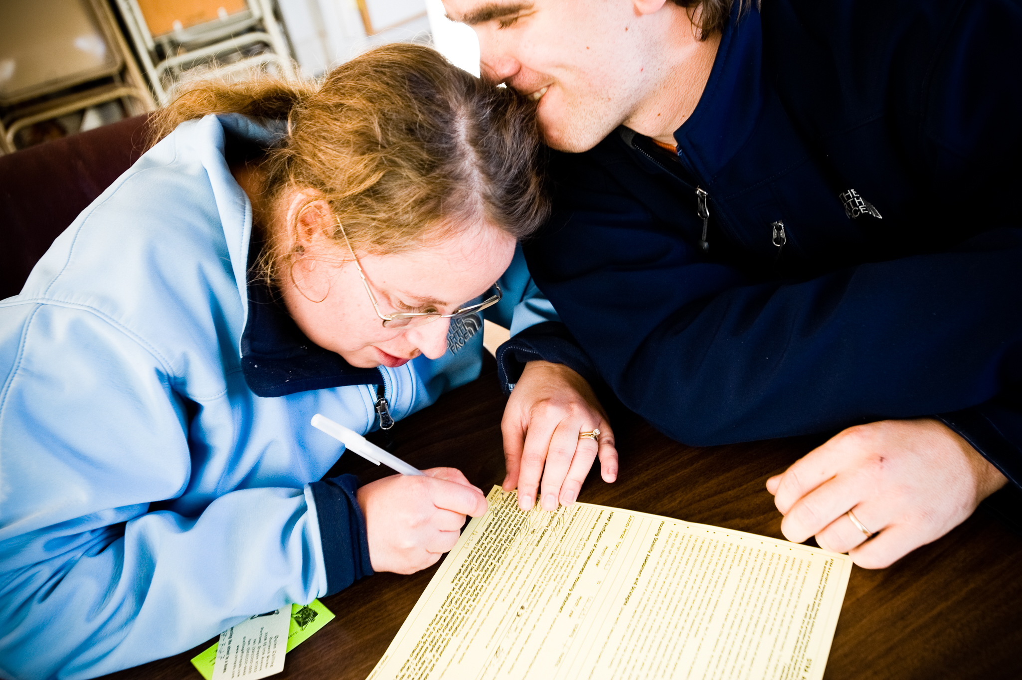  On a red letter day, Melissa and Sean sign paperwork for their new apartment at the non-profit Join, an organization that helps homeless folks get into permanent housing. Join will pay for their deposit and first month's rent. 