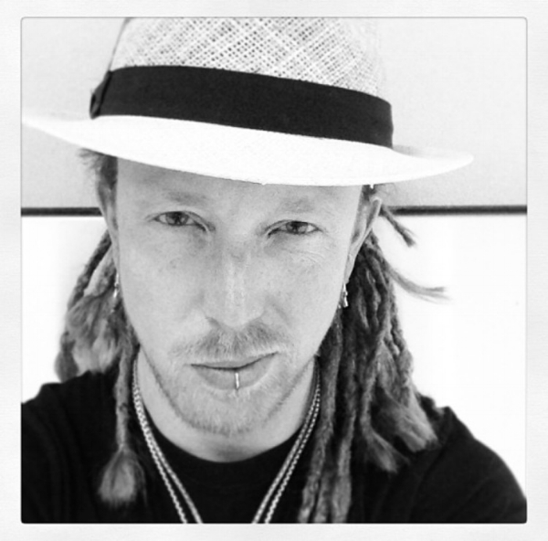  When it comes to knowing the pulse of a career in entertainment and as a touring musician, Barry Kerch has a few years of experience to say the least. This week EHS had the pleasure of talking with Shinedown’s drummer Barry Kerch on his personal journey through music. Barry shares with us his insights on maintaining a strong headspace, the importance of relationships in long term band success, managing stress, and views on mental health in the industry. Having been with Shinedown from the beginning over 15 years ago, Barry has experienced the shifts in the music industry, especially with the impact of technology developments and social media. We asked Barry how he has kept a positive headspace throughout years of changes and if social media has any affect on this for him? Barry tells us self-care/exercise, good communication/relationships with the band, and avoiding negative commentary on social media, keeps things in check for him. He explains that he and other band members often hold each other accountable for keeping routine with exercise and feels he plays a better show when he makes time for it. Barry laughs as he states, “My 30’s caught up with me and I could no longer eat and drink whatever I wanted”. As for bandmate relationships, we can't help but turn to Shinedown’s video for “Enemies”, which plays off the idea of a band meeting gone bad. However, based on our discussion with Barry, we are rest assured there is no chair throwing amongst band members. Barry states they are supportive of one another and it feels more like family. Barry admits they have all experienced ups and downs, including lead singer, Brent Smith’s struggle with substance abuse and inspiring achievement of kicking his drug addiction. Barry reports he feels they became a better band after the making of their third album, Sound of Madness (also being around the time of Smith quitting drugs and band restructure). At EHS we hear a lot about the impact of social media on entertainers, including online feedback and the temptation of comparison. Barry replies to this with “We’re already stuck in our ways”, referring to his personal security in who he is and Shinedown as a band. Barry states “people say things on social media, they would never say in person”. He encourages others to embrace their music and avoid spending too much time reading comments on social media. He tells us in the end you are doing it for yourself and although the feedback can be encouraging, don’t get hung up in negative feedback. Barry state's social media can be positive for some artist as a way to put themselves out there and for fans to have greater connection with artist. However, the negative impact of criticism or online bullying can be detrimental. We asked Barry if a career in music is what he expected and without hesitation, the response was “no, not at all”. Barry states a big surprise was learning the dynamics of the partnership with record labels. Initially he was unaware of how much influence the labels had on the band and decision making. He talks about there being times you would advocate for certain songs or decisions and times you need to trust the label to call the shots. Barry doesn’t express any animosity when discussing this partnership structure, but rather seems to emphasize a need to be flexible and accepting of the labels ultimate decisions. Barry says a career in entertainment “is work, you have to treat it like a business”. He reports he would often practice 4 hours a day instead of hanging out with friends. His advice being to select days for practice and then slot out a night or two for friends. He stares it is important to find balance and structure time for music. Although it is hard work, Barry shares with us that he is living his dream to be able to do what he loves. When we asked the worst job he ever worked, Barry replied “cold calling people to ask if they wanted Sprint or AT&T”. It seems telemarketing will not be in Barry’s future endeavors! When it comes to the overall stress of the industry, it appears Barry has adapted a sense of flexibility and humor to handle the various uncertainties. Barry tells us a story about a show Shinedown was headlining in Tampa. Like any musician's nightmare, the power went out and they couldn’t get enough generators working to run all the equipment. Instead of canceling the show, they got a couple of mic's running and played an acoustic show. He says he believes many of the fans thought it was done on purpose and they got a special acoustic show. It seems there is always an opportunity for things to go wrong and this is a prime example of being ready to adapt to the circumstances and diffuse stress. The time off touring when singer Smith decided to take needed personal time was stressful, but Barry reflects “it was important we paused for him to get help”. In an industry of little guaranteed security, the band members also have families at home to consider, adding another layer of potential stress. Barry takes a moment to talk about his daughter and how quickly she is growing up. Although there is the expected stress of being on the road, Barry states he does the best he can and makes use of FaceTime. When talking with Barry, you get the sense that stress and worry take the backseat in his life these days. Perhaps years on the road as an entertainer exposes you to more of life's curveballs, resulting to more instinctual stress management. Mental health is often a difficult discussion in the entertainment world and we are grateful for Barry and others in the industry who are willing to broach this topic with us. When we asked what changes he would hope to see with mental health and the music industry, Barry stated “I would like to see people willing to talk about it, especially labels”. Barry reported the biggest holdbacks with this that he sees is “the fear of admitting defeat, putting things on hold (touring, music), and being dropped by a label”. Although there may not be any quick fix, it is discussions like this that help move things in that direction. Barry tells us there have been times fans share mental health struggles with him online and it is difficult knowing he cannot directly help them. On the other hand, he has also received messages crediting Shinedown’s music for helping them through tough times or even steered them away from suicide. These experiences show both the positive power of music and the importance of mental health awareness. Many of Shinedown’s songs can be seen as relatable to issues of mental health, including substance use, bullying, and depression. Regardless of what inspired the song or what genre it is put into, the impact is there. The fact is, music and emotions share the same stage. Mental health shares a stage with emotions. Therefore, they’re all playing the same show. EHS believes in the power of music and works to continue bringing mental health topics to light in the entertainment world. For now, we are extremely grateful for entertainers like Barry Kerch for speaking with us and Shinedown’s overall transparency in sharing their experiences with such topics.