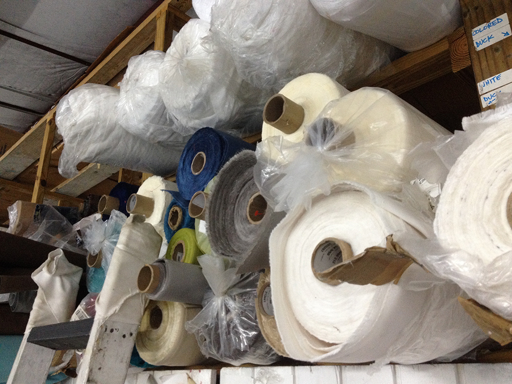 blank bolts of fabric at the studio