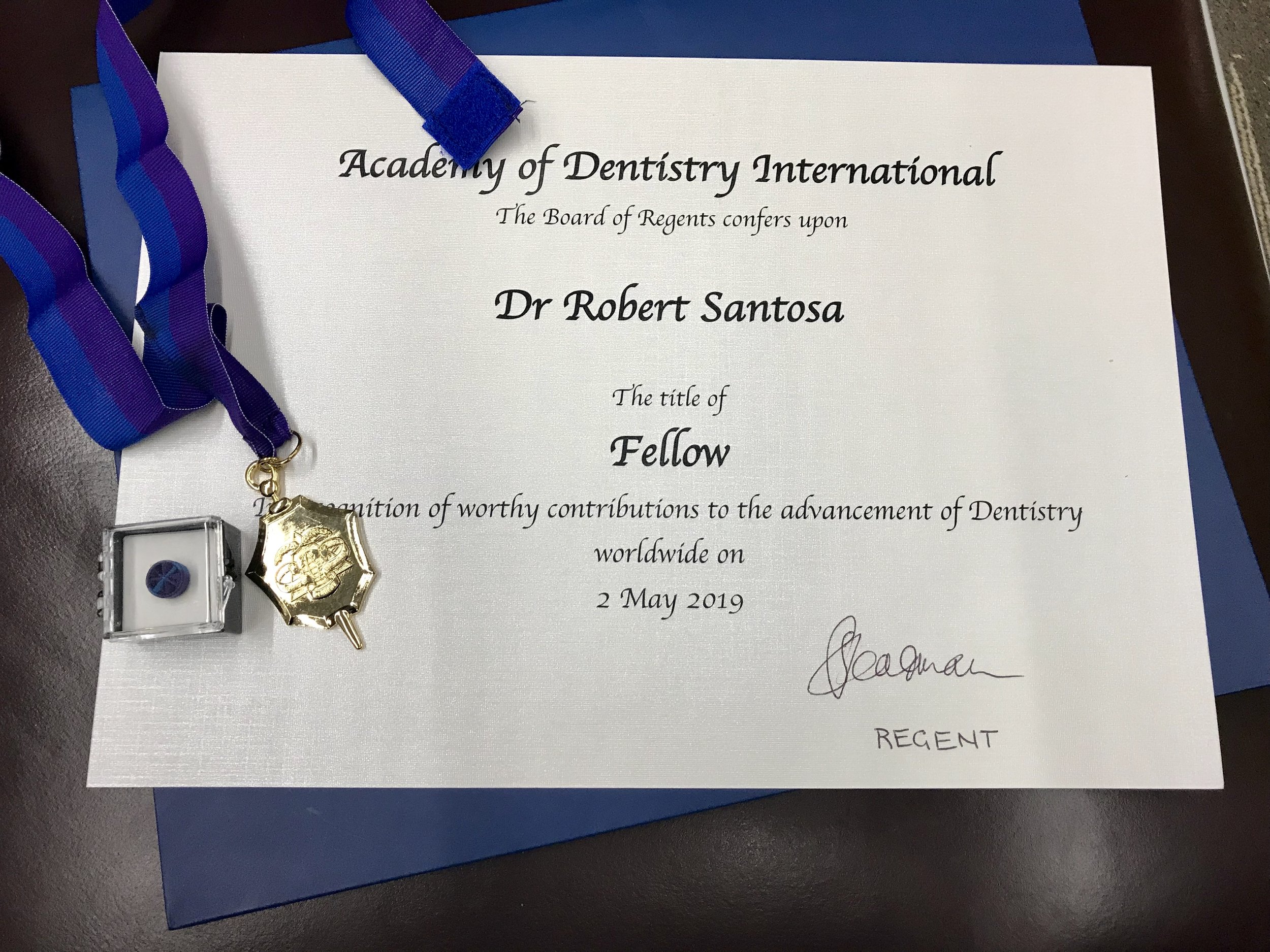 Robert Santosa award dentist.jpg