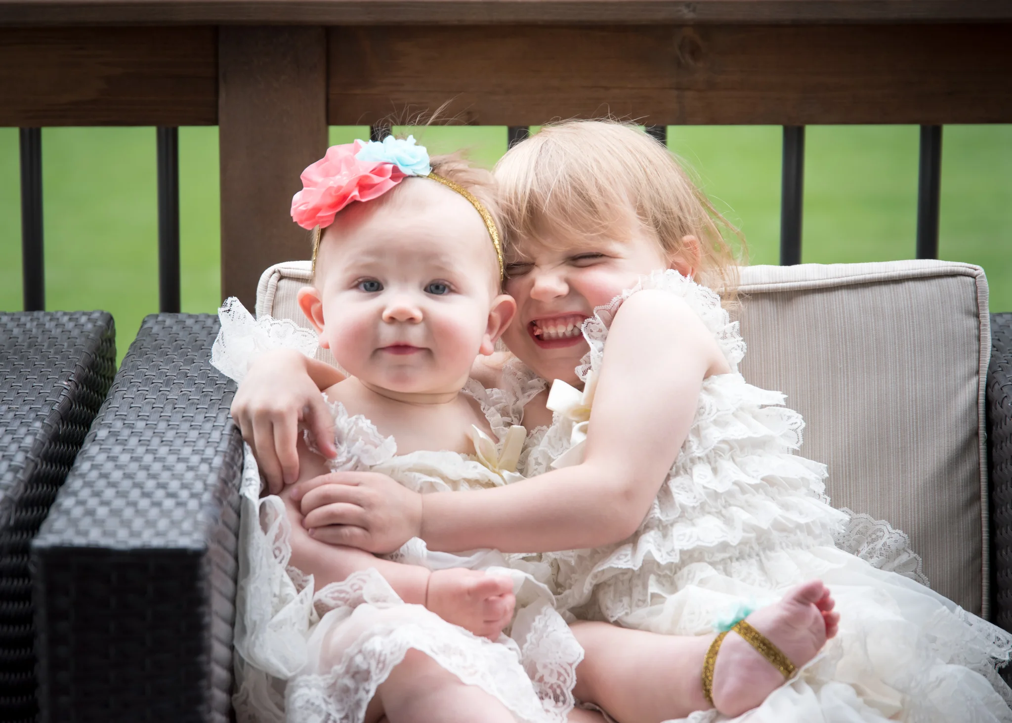 Two girl siblings hugging