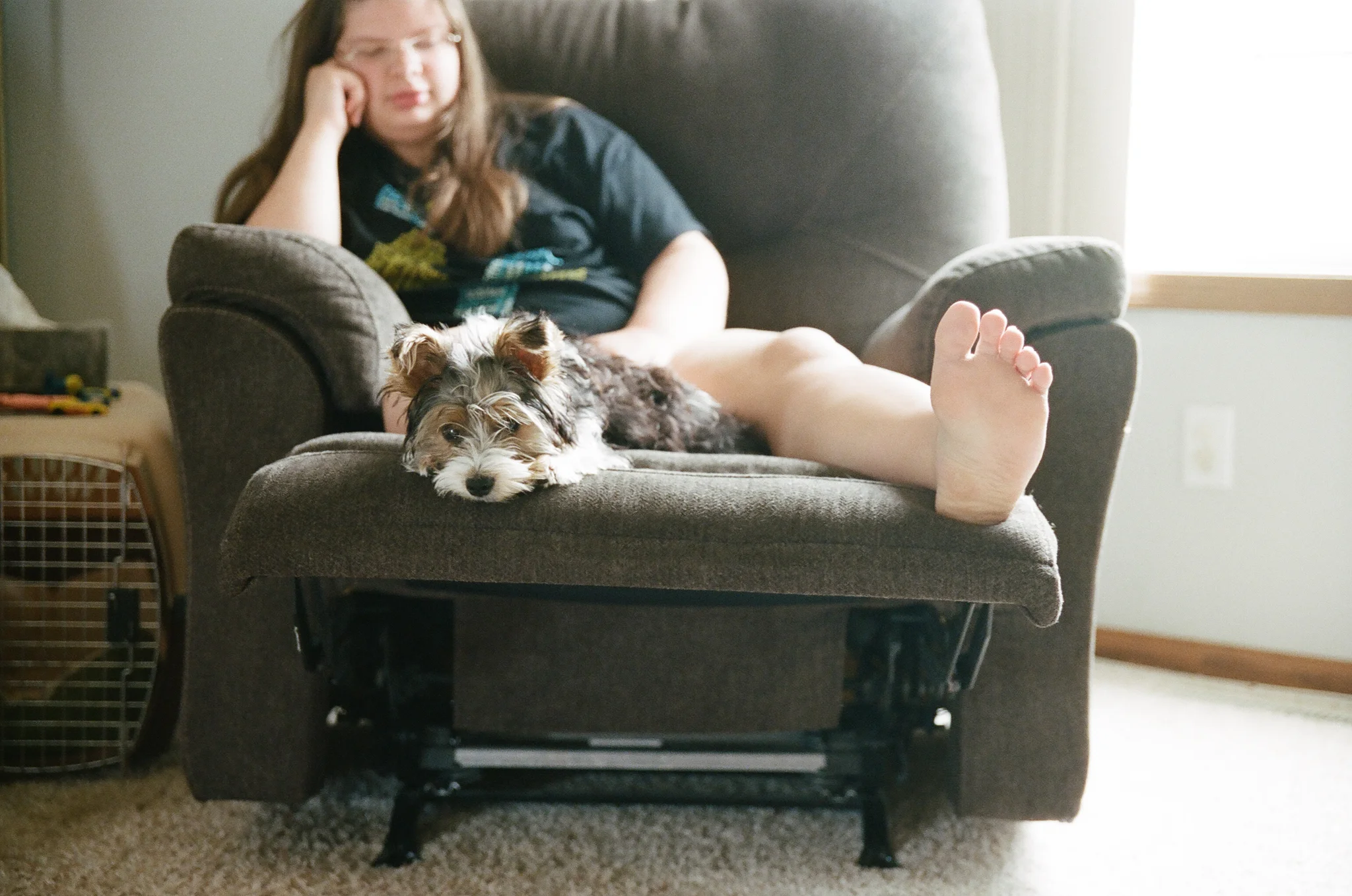 Girl and puppy relaxing