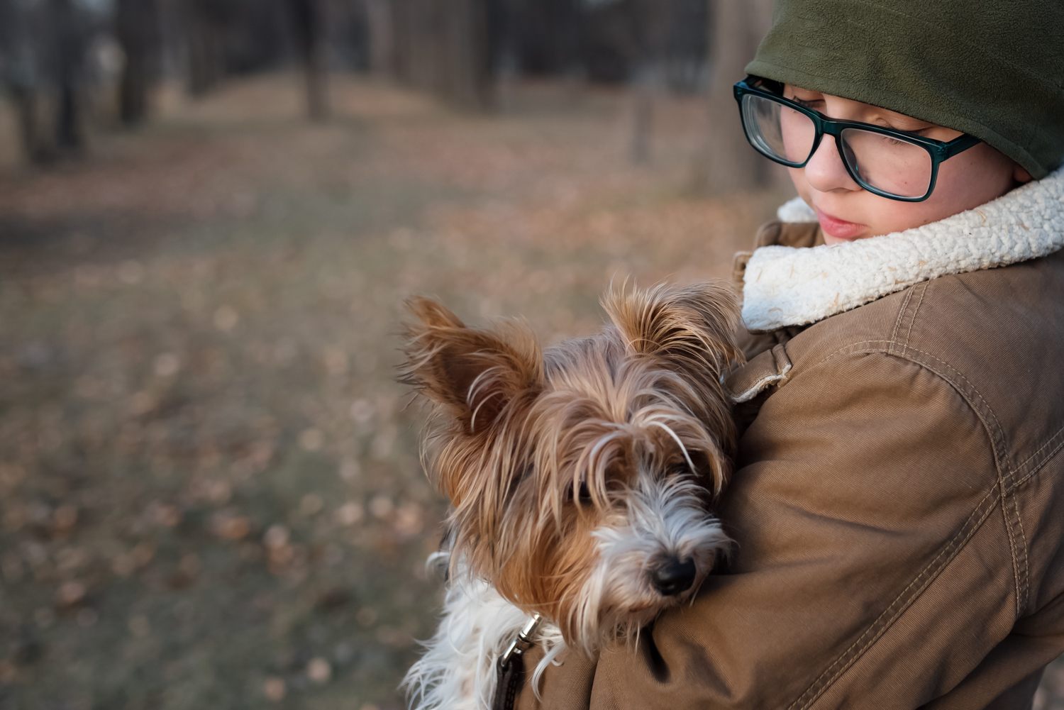 Photo by Mindy Sauvageau (www.orangemoonphotography.com) Boy and his dog walking in a park in West Fargo.
