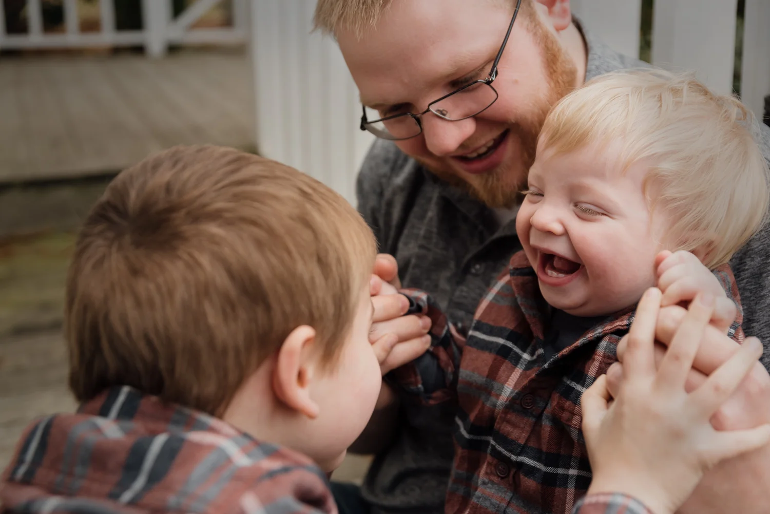 A Dad and his boys laughing and playing during a session in Texas.