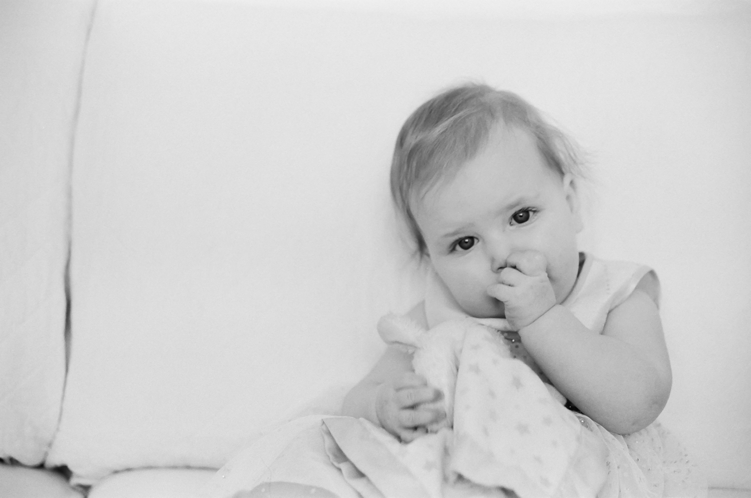 Nine month milestone portrait on film of a little girl.