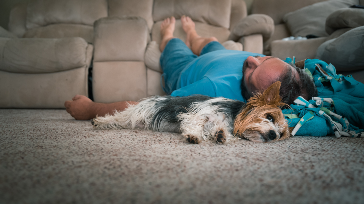 Dad relaxing with the family pet in Fargo, ND.