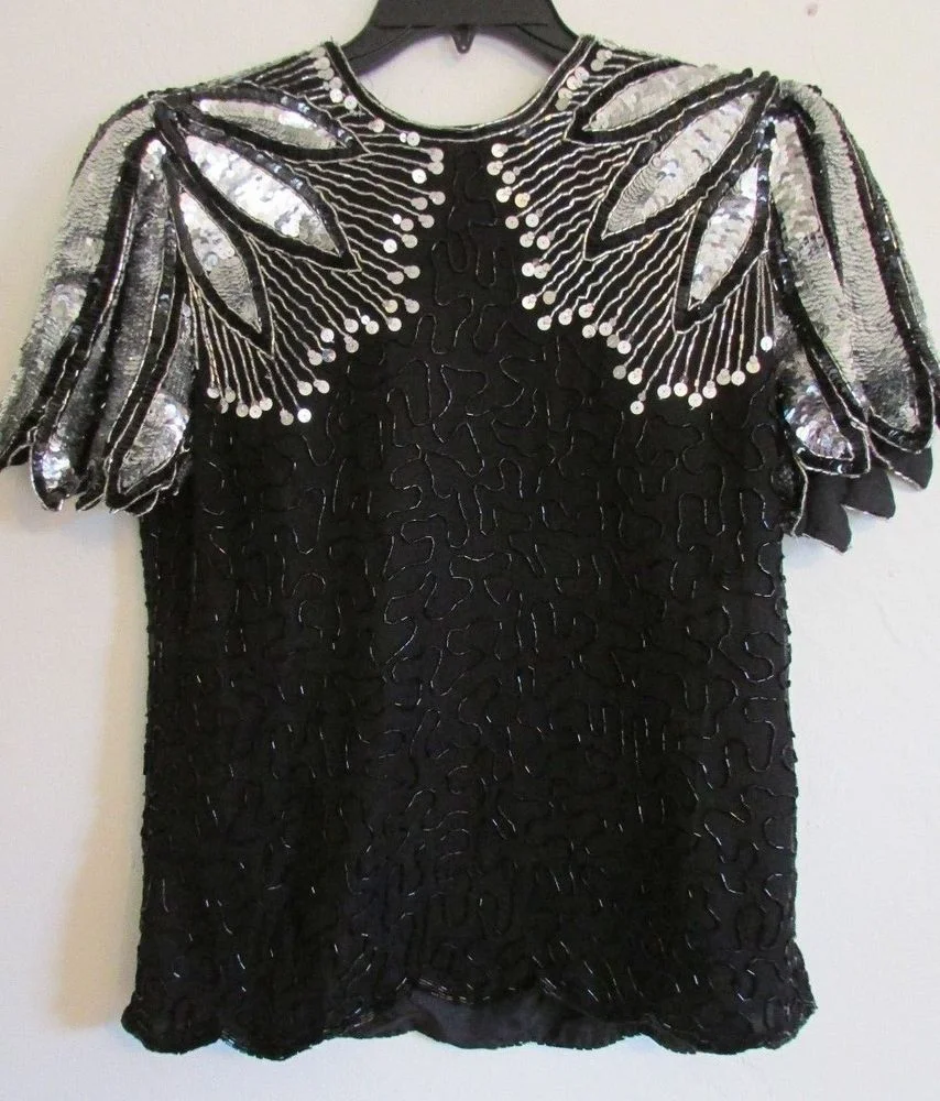 I snagged this vintage top for a party and I love it. I mean seriously I try to find places to wear it because it makes me feel so happy. Call me - we can go out in sparkly shirts.