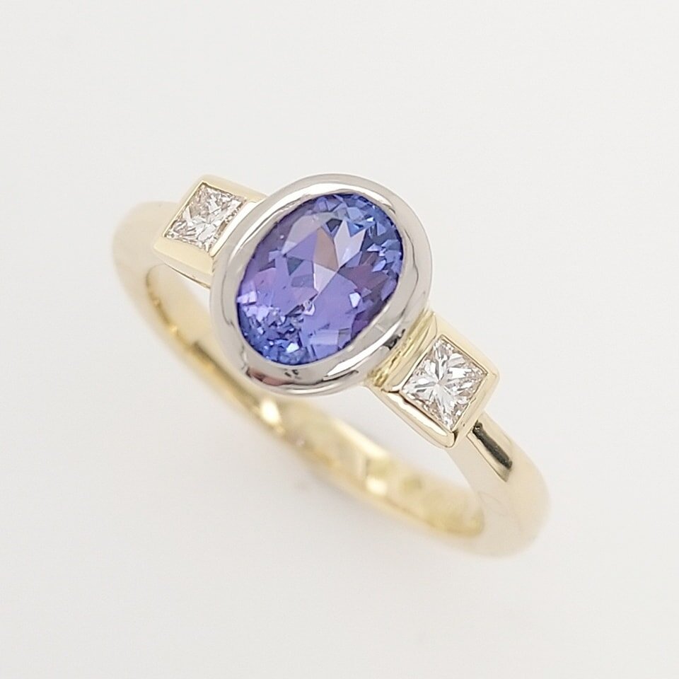 We just finished remaking this tanzanite and diamond ring for a lovely customer. 
The design didn't change, the old ring was just worn out and too thin to protect the gemstones. We dismantled the original ring, repolished the table of the tanzanite a