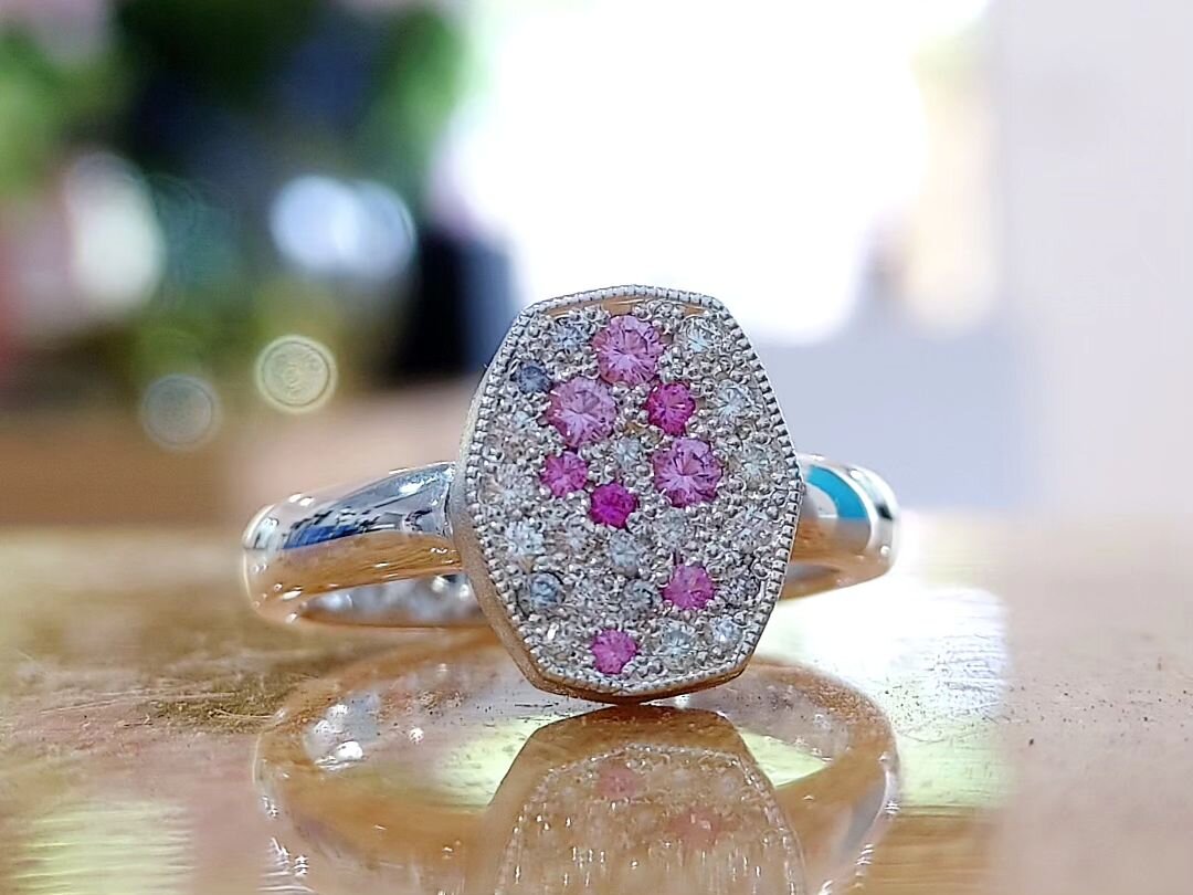 &quot;Sprinkles&quot; - A dress ring featuring mixed diamonds and pink sapphires, scatter pav&eacute; set with millgrain edging and a glitter satin texture on the setting walls with a high polished band. Made by Venetia and is a one-off piece.
