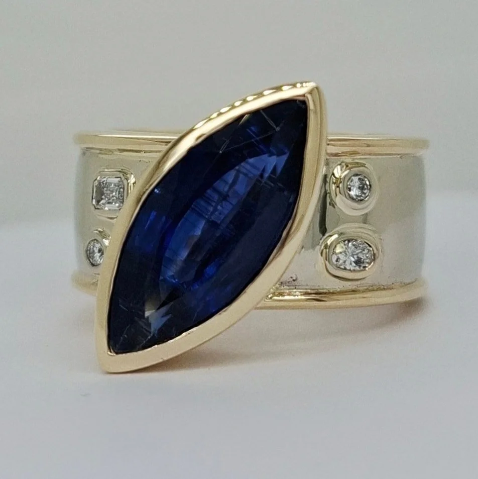 The epic marquise shaped sapphire ring we designed and made for K. The parallel lines you can see in the sapphire are natural inclusions. Like the fingerprint of the stone, no other sapphire in the world would have exactly the same markings.

 #sapph