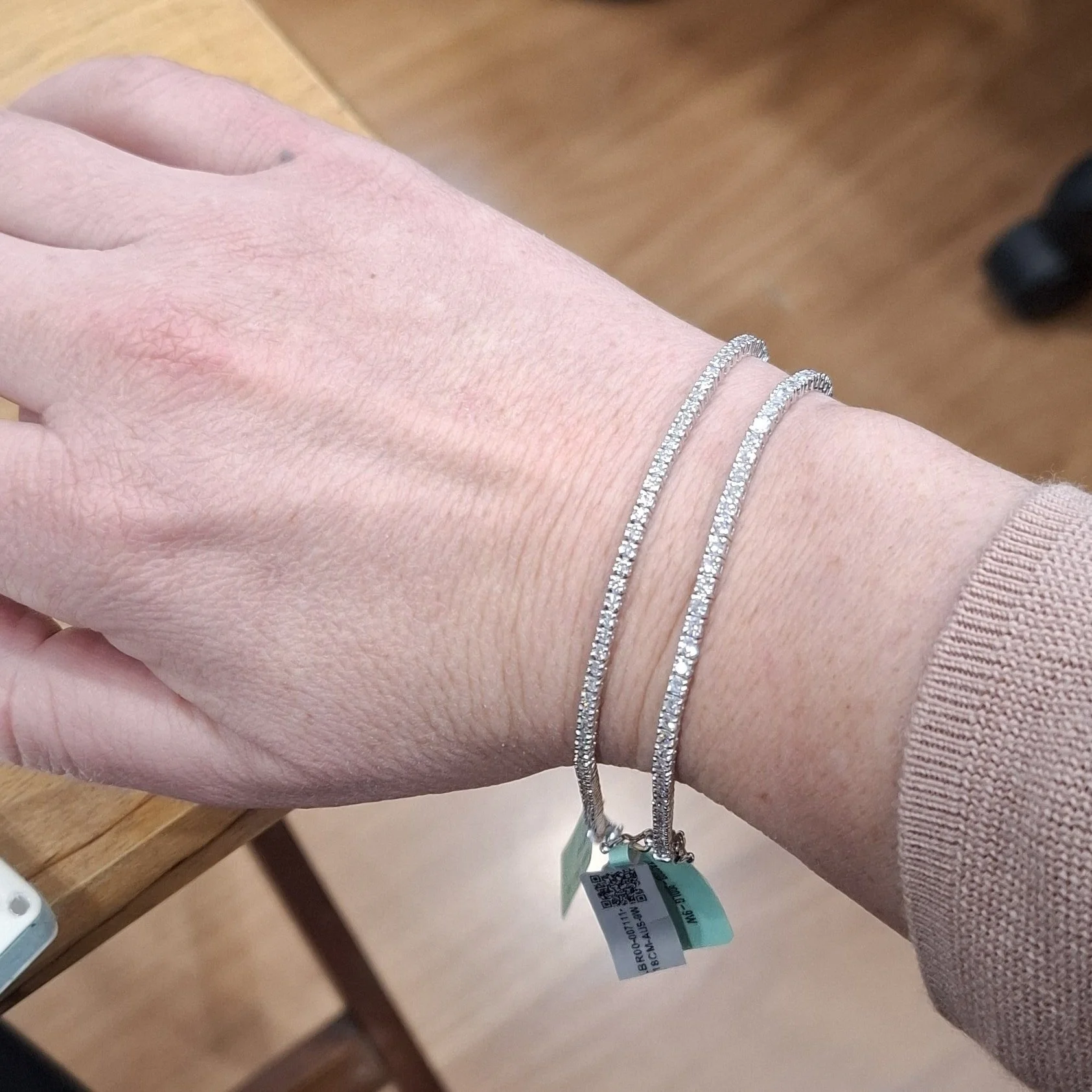It's my 40th soon and I'm looking for a diamond tennis bracelet for my husband to generously and thoughtfully gift to me.

Which size do you think looks better? I'm wanting something that is petite and understated, that won't get in the way when I'm 