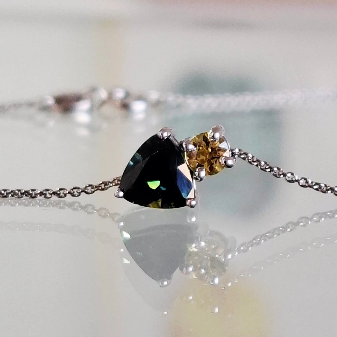A new piece to add to our collection. A platinum slider pendant featuring natural Australian green and yellow sapphires. Includes the fine platinum cable chain with 2 length choices. Available online and in store now.