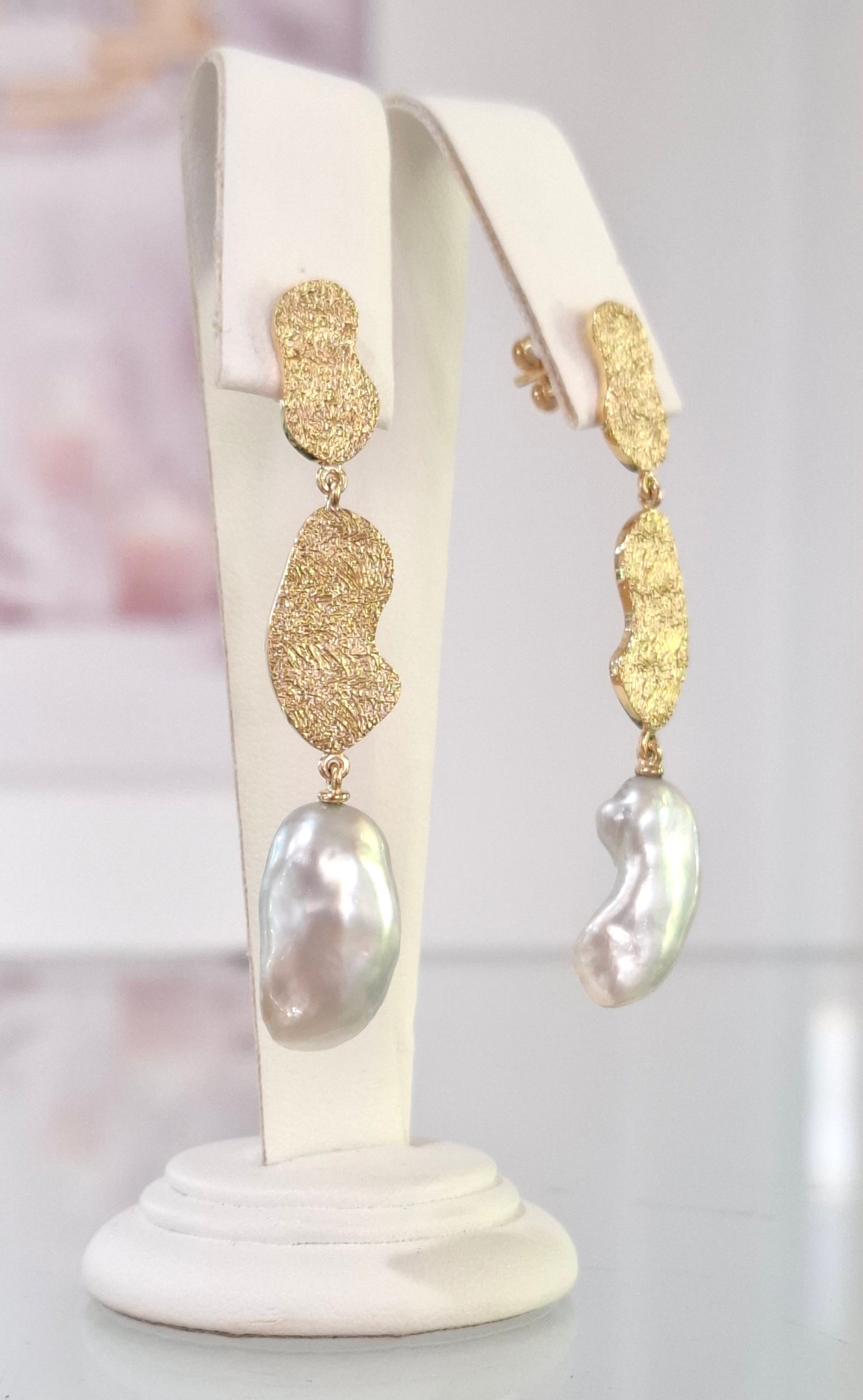 Keshi pearl drop earrings in 18ct yellow gold with heavy textured pebbles.
