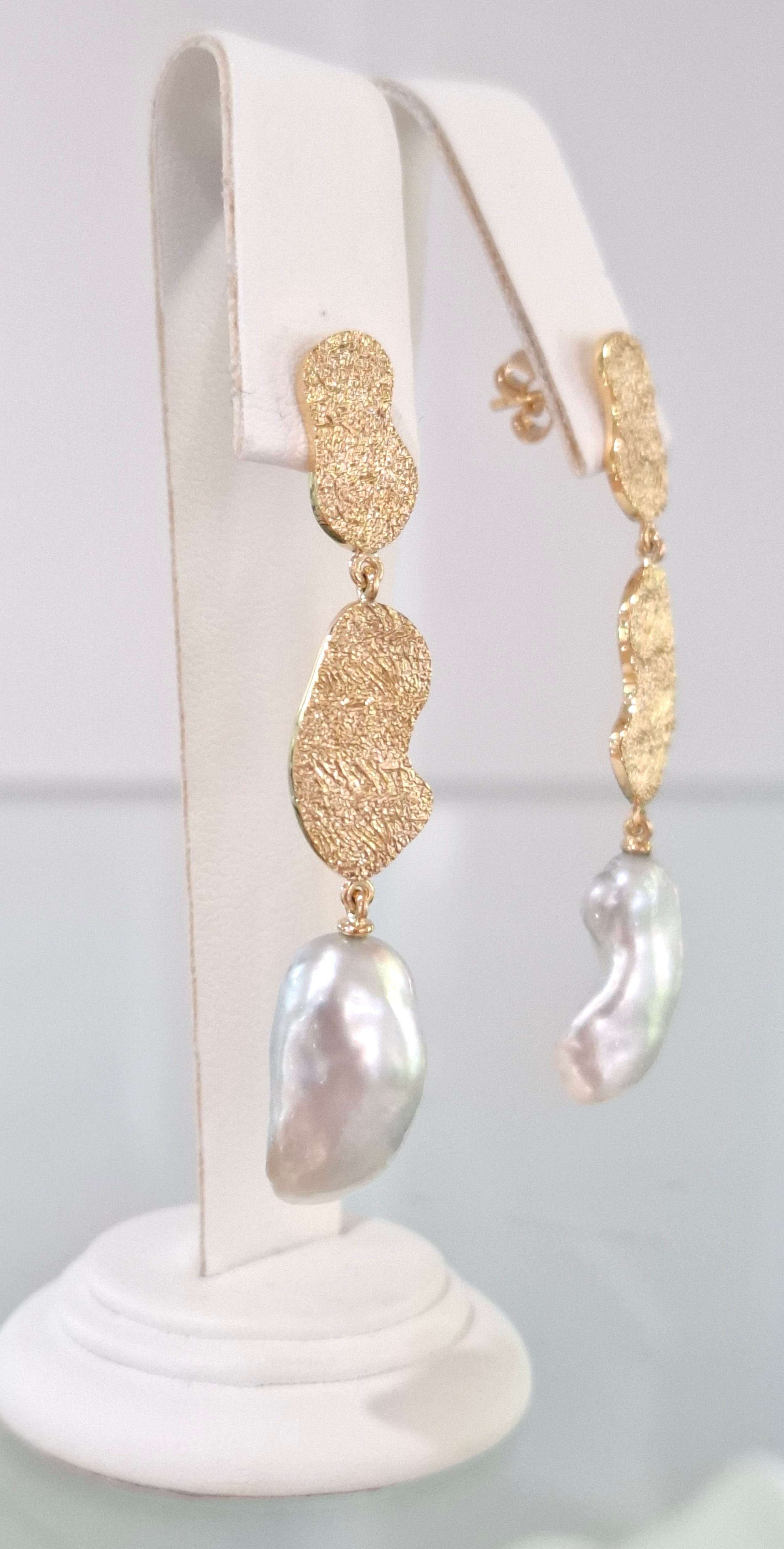 Keshi pearl drop earrings in 18ct yellow gold with heavy textured pebbles.