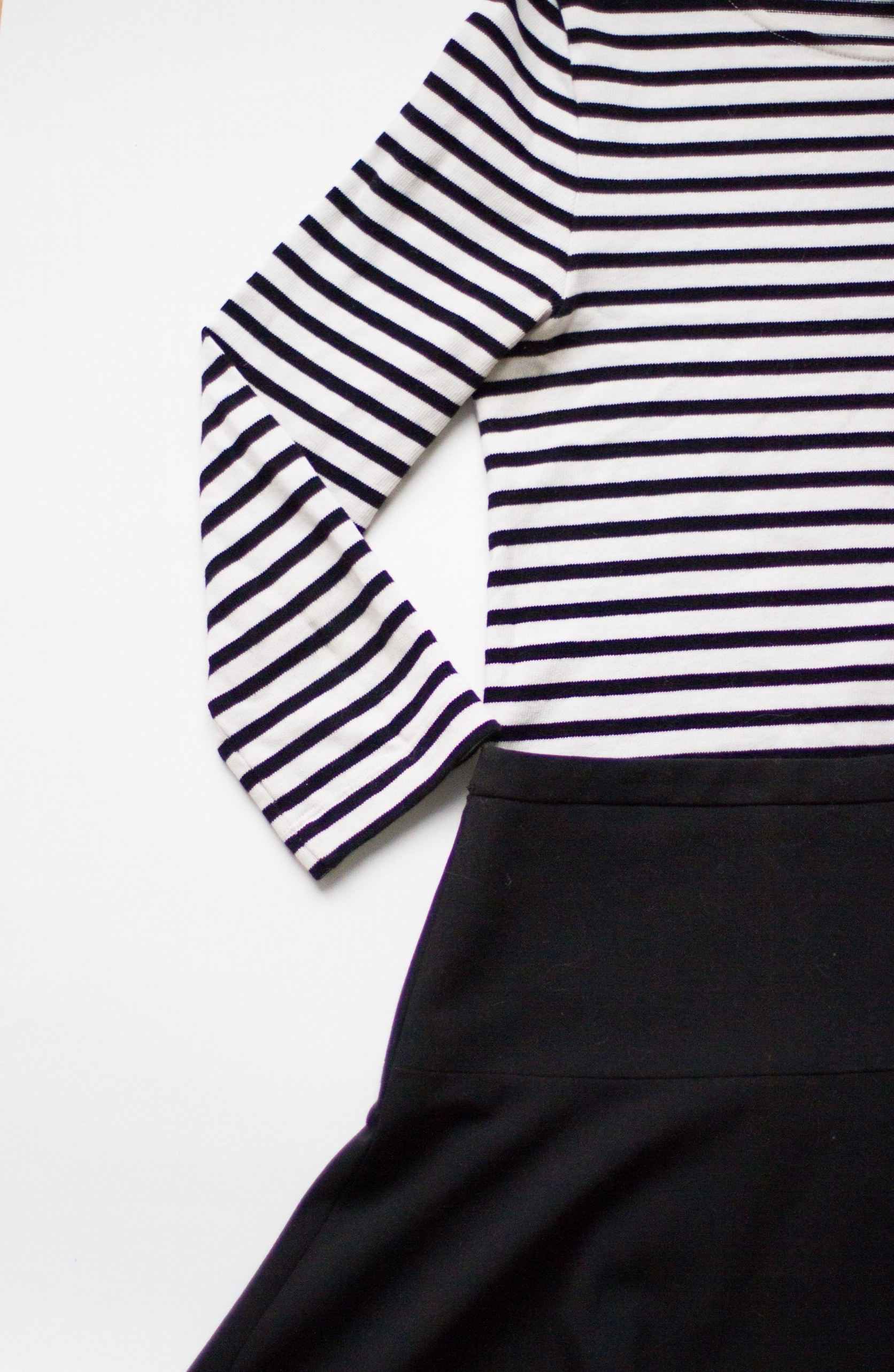 striped top / black skirt