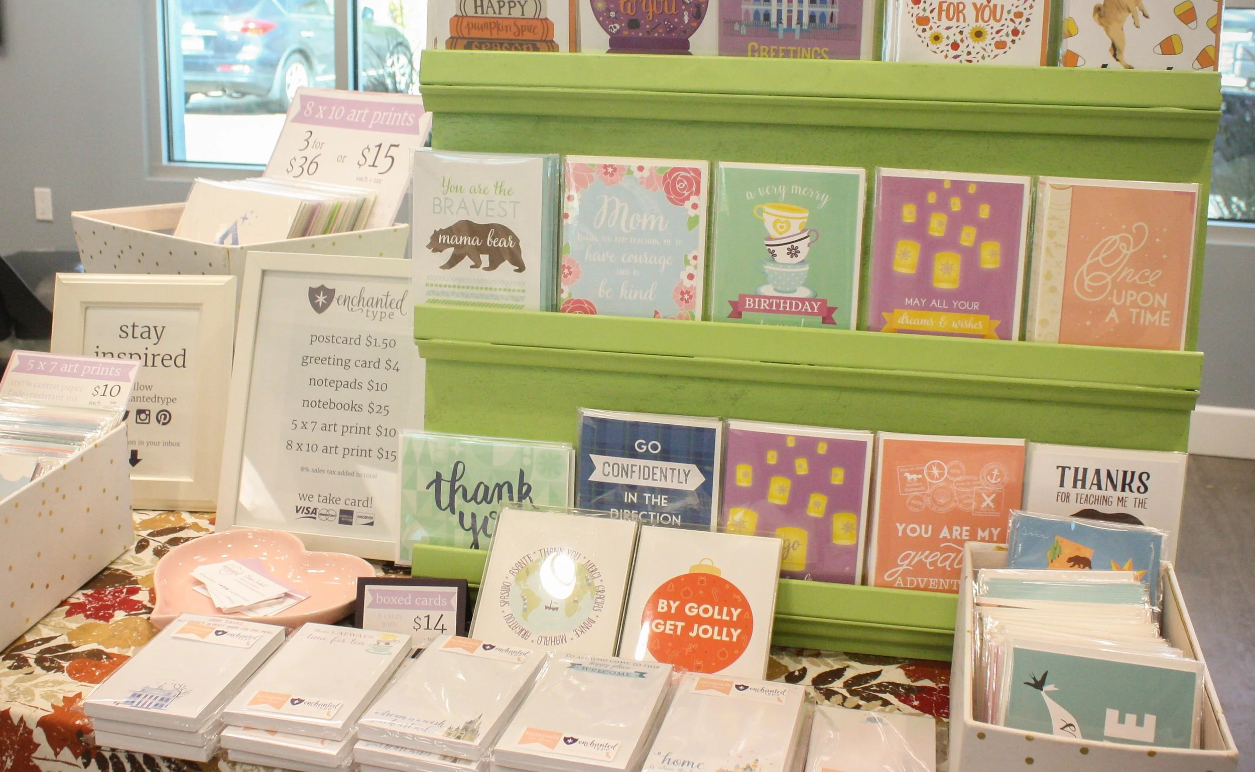Stationery greeting cards and notepads on a table with price signs