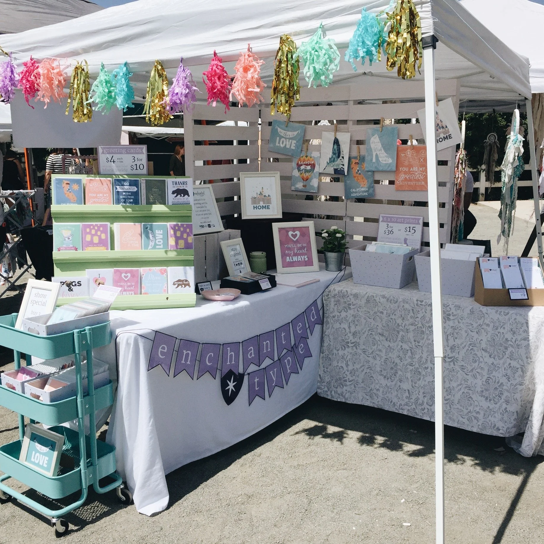 Stationery small business outdoor booth with colorful greeting cards, art prints and notepads