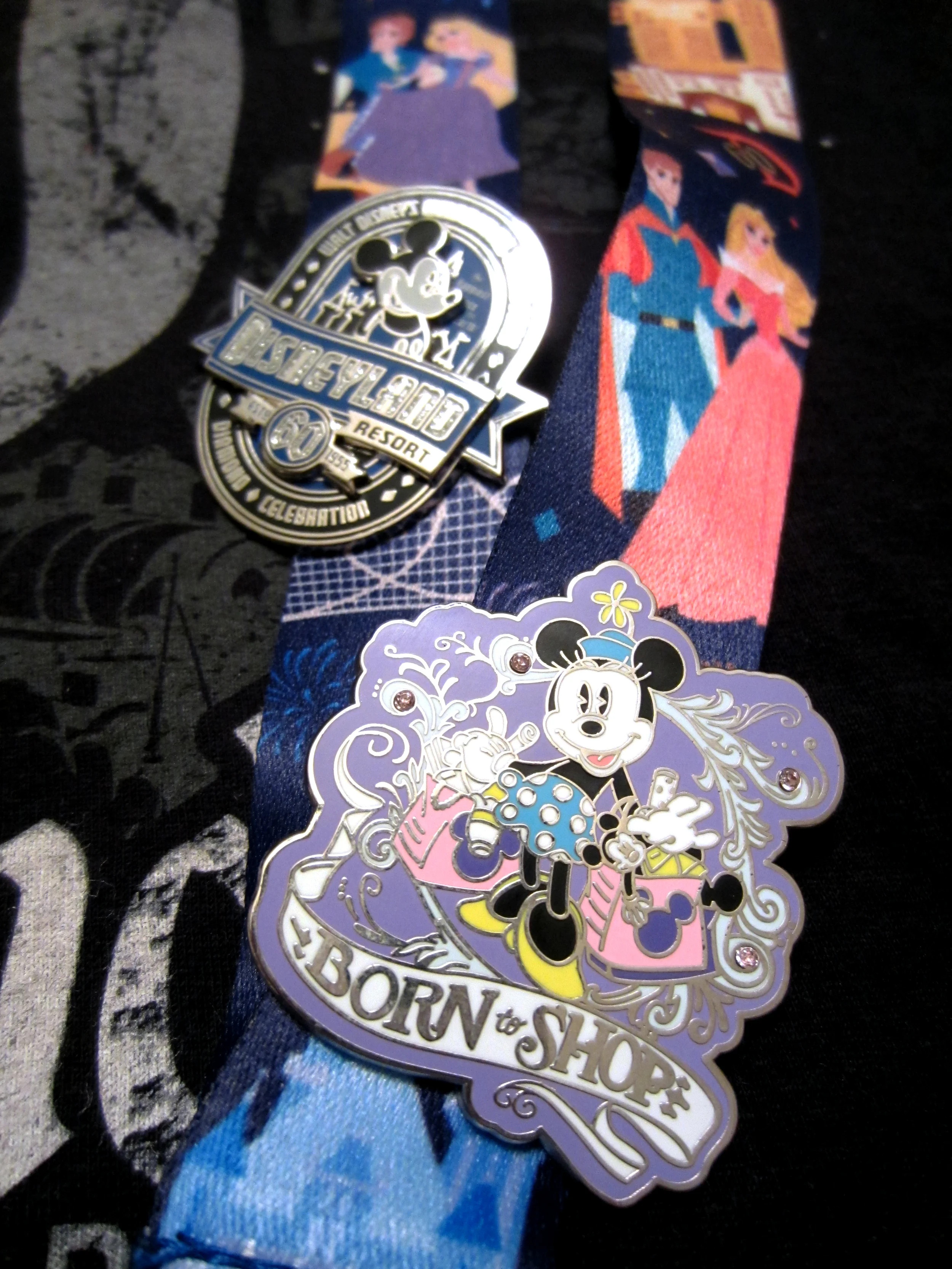 Of course I knew I couldn't leave without getting some new pins! And I really love the 60th Anniversary lanyard they designed. It has all of my favorite characters and attractions on it!