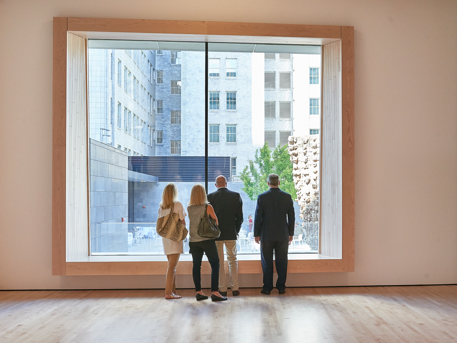 Huge windows on nonlinear walls. The traditional buildings in the back give away how asymmetric the walls and window frames are. 