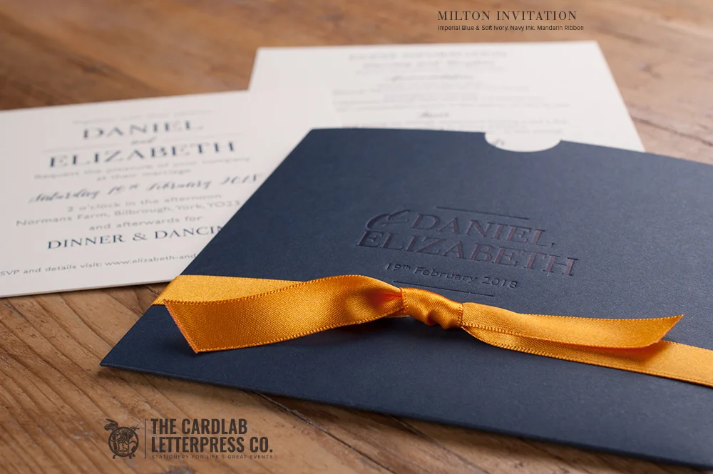 Modern Invite with Navy Wallet and Mandarin Orange Ribbon Milton Style