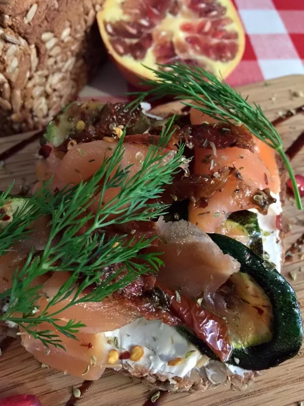 A Frazer 'special open sandwich' - Sunflower Rye bread with cream cheese, grilled courgettes, smoked salmon, dill and pomegranate