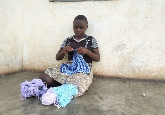 Sophie at the Ewafe home doing some knitting.