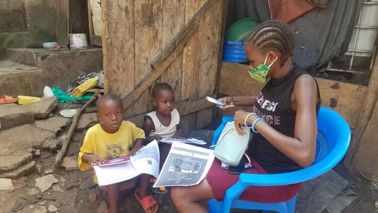 Kids Club Kampala volunteer teachers have been giving lessons and materials to children living in Kampala’s slums
