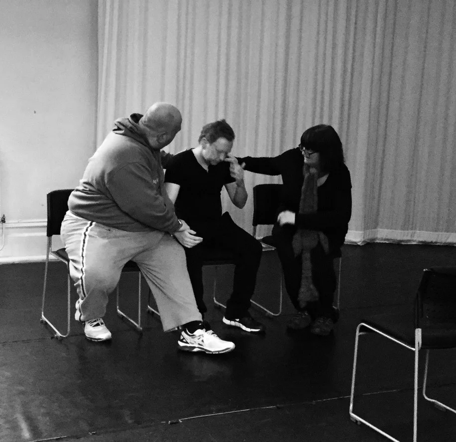 Three actors devise an emotional scene