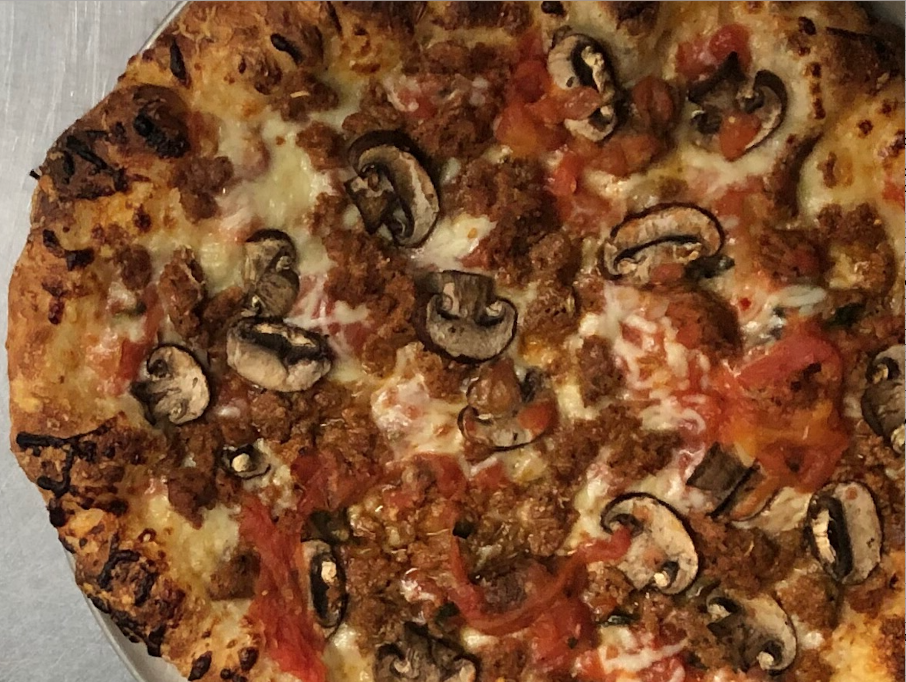 Sausage & Mushroom Pizza - closeup.png