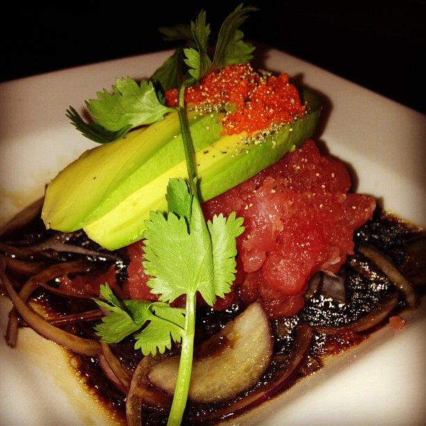 Craving something fresh? Try Tuna Tar Tar! Minced tuna on a bed of red onions and balsamic vinegar topped with avocado smelt roe and cilantro!