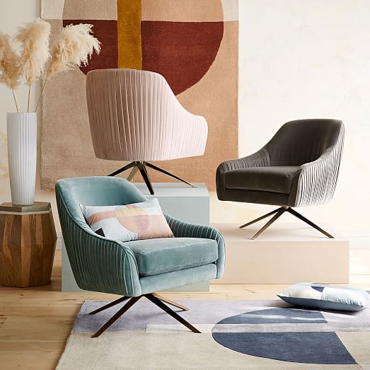 Blush and muddy turquoise modern swivel chairs.